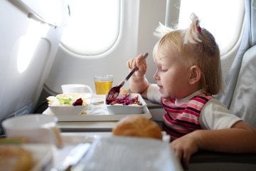 Learn what to pack when flying with kids and what they can eat inflight