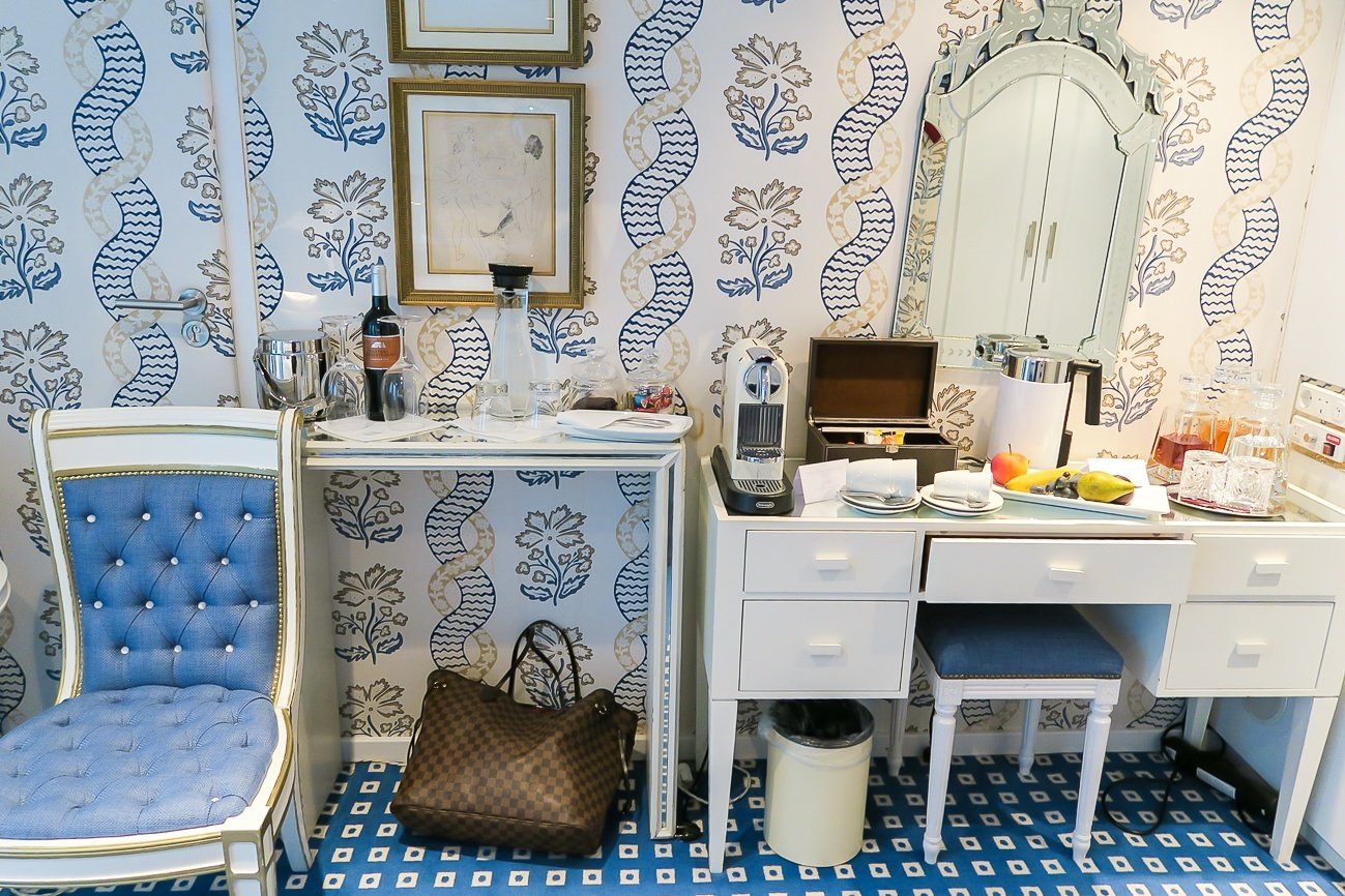 Wine, Nespresso, fruit, water, tea and other amenities in Uniworld's River Queen ship suites.