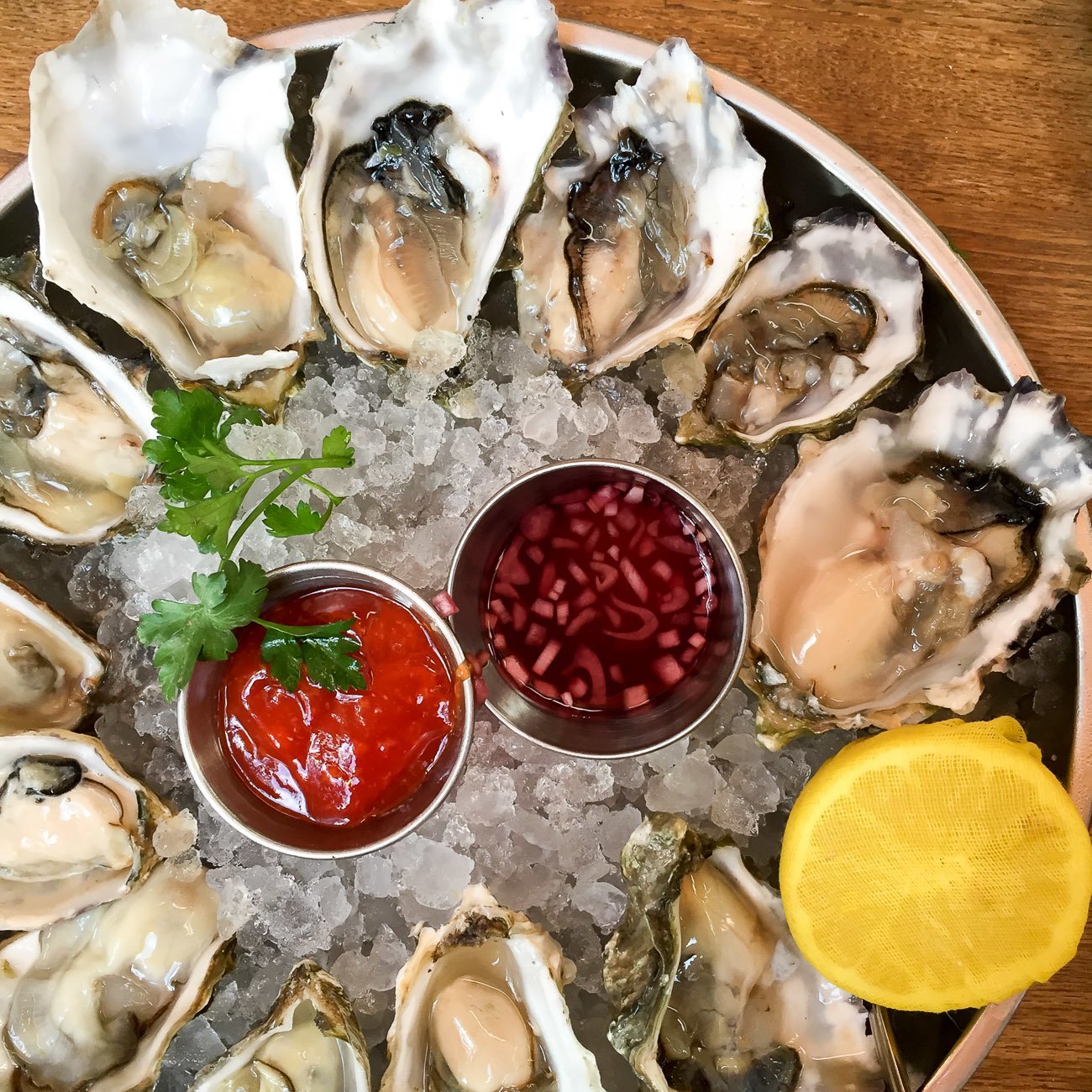 Oyster hour at Herringbone is on weekdays between 4:00 - 6:00 p.m. where oysters are $1 and other bites and some drinks are discounted.