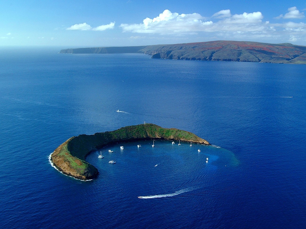 A review of our snorkeling tour around Molokini island with Kai Kanani charters and what we say underwater.