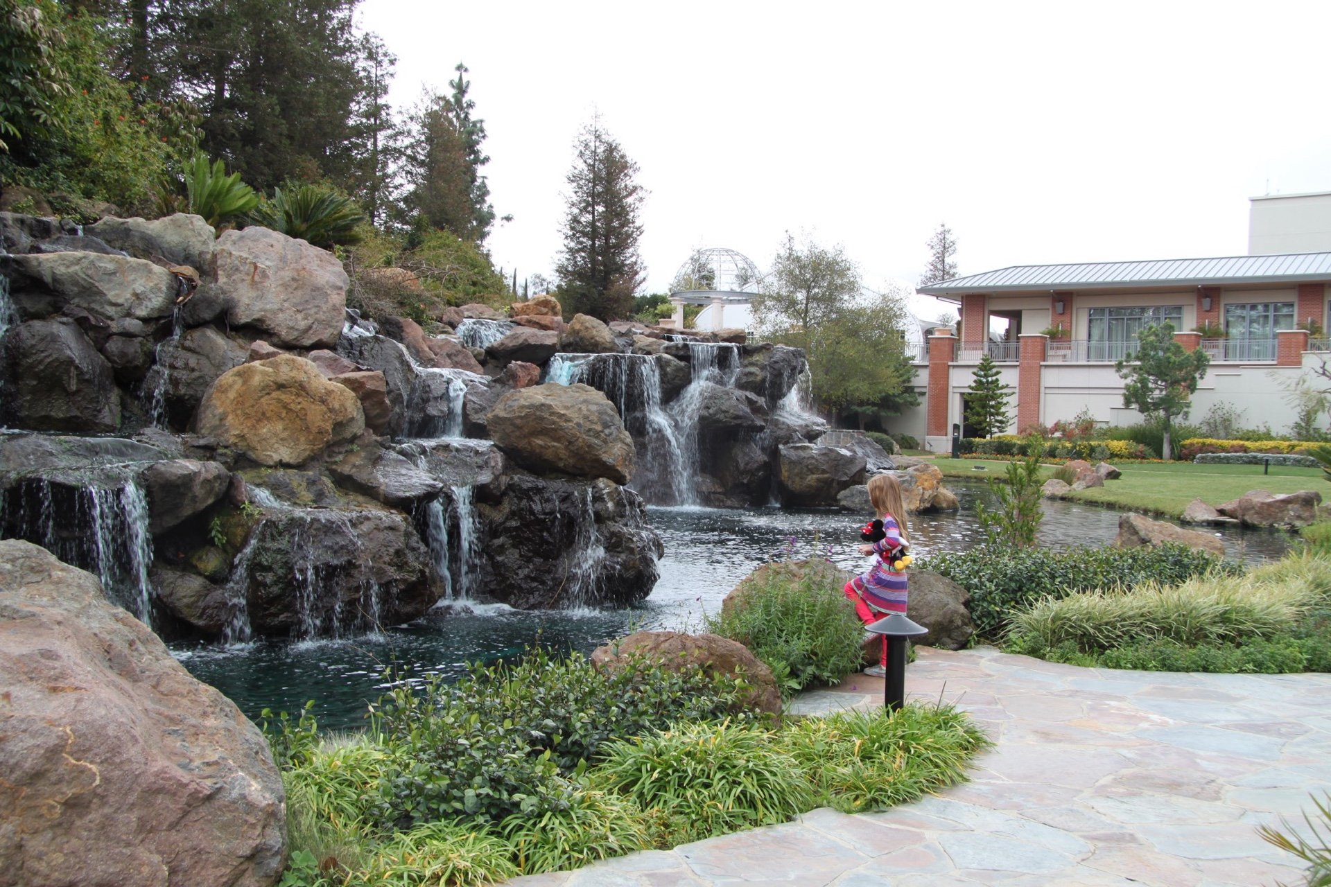 My daughter looks at the waterfall at Four Seasons Westlake Village.