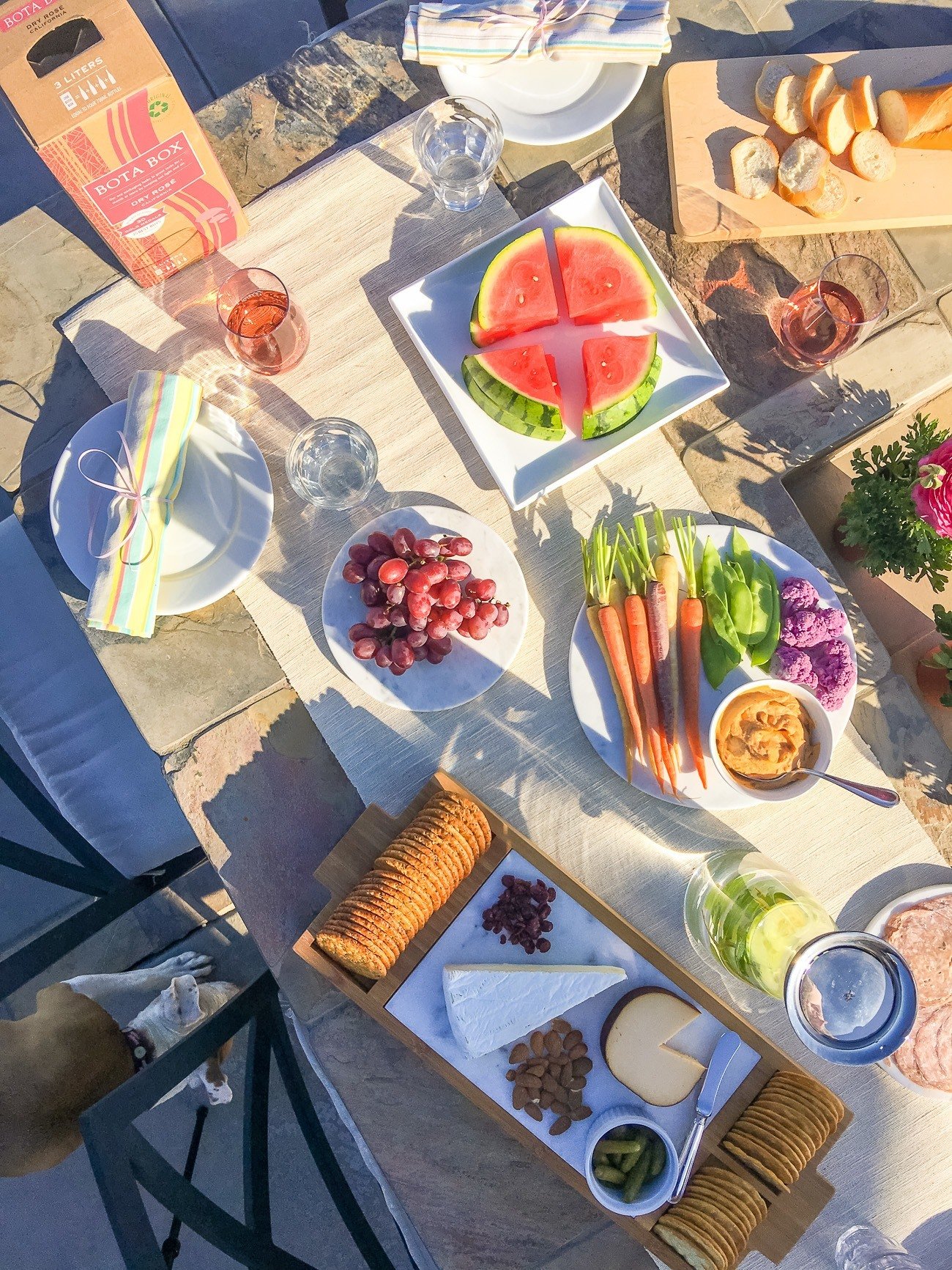 Throw an easy outdoor happy hour that's eco-friendly with these tips (including the wine).