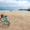 A blue bicycle on the sand of East Beach in Santa Barbara.