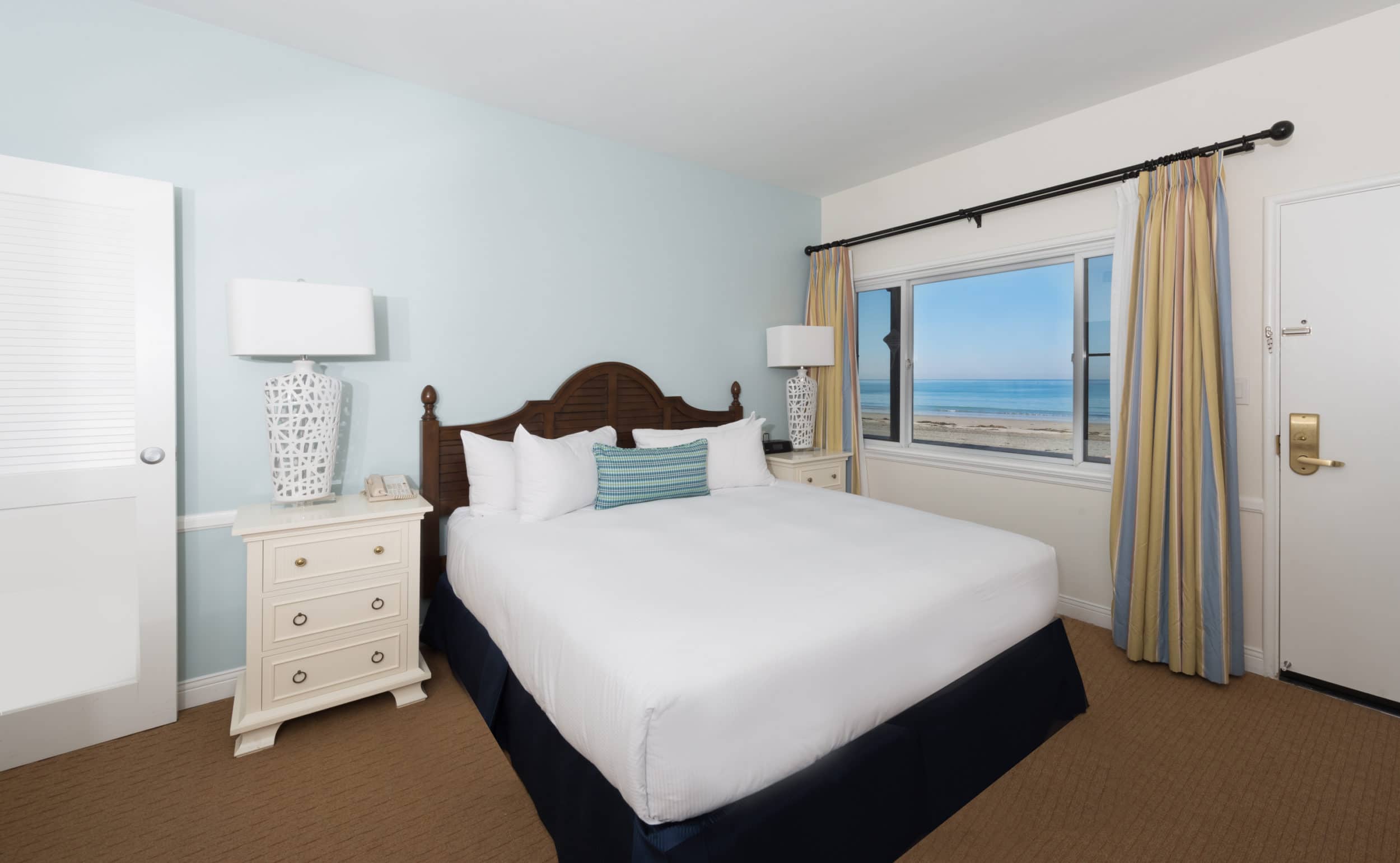 Guest bedroom interior in coastal colors at La Jolla Beach and Tennis Club