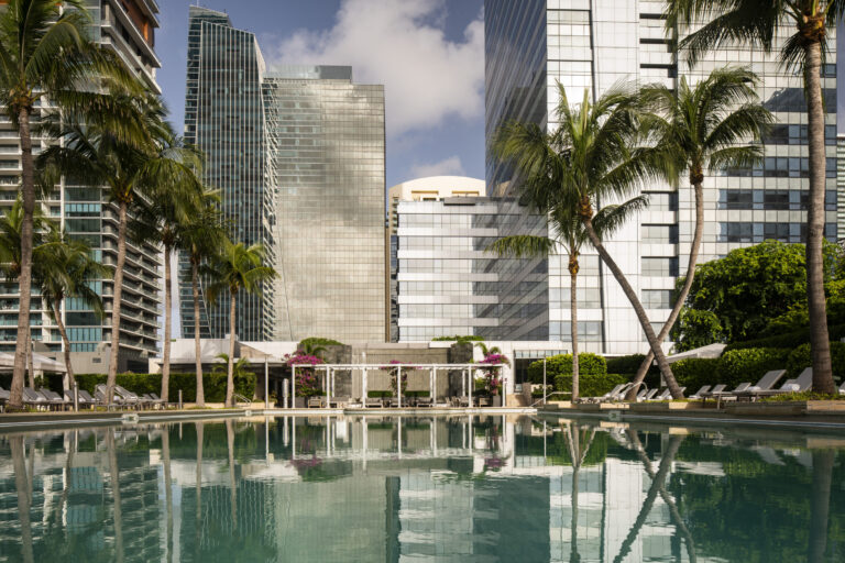 Skyscraper reflections on the hotel swimming pool.