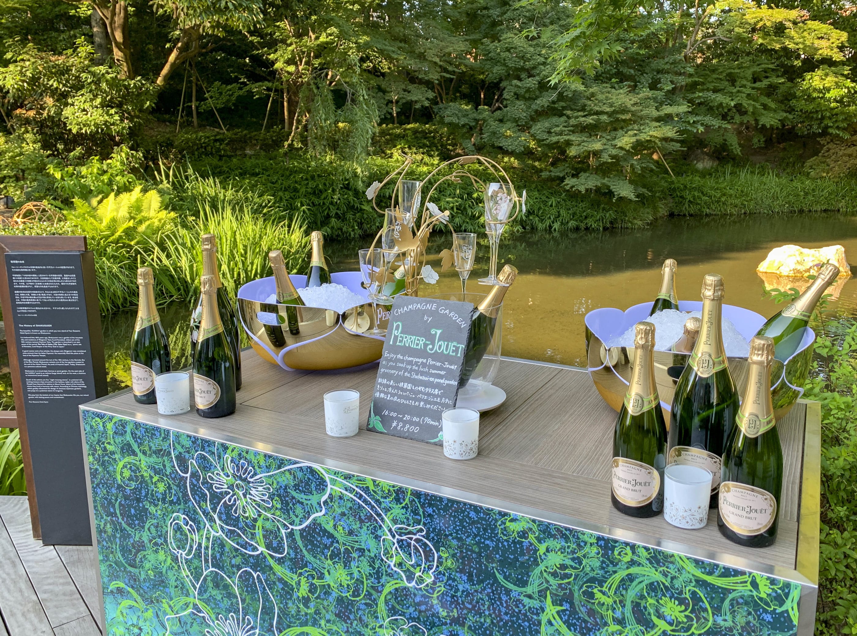 Perrier Jouet champagne on a cart in the hotel garden.