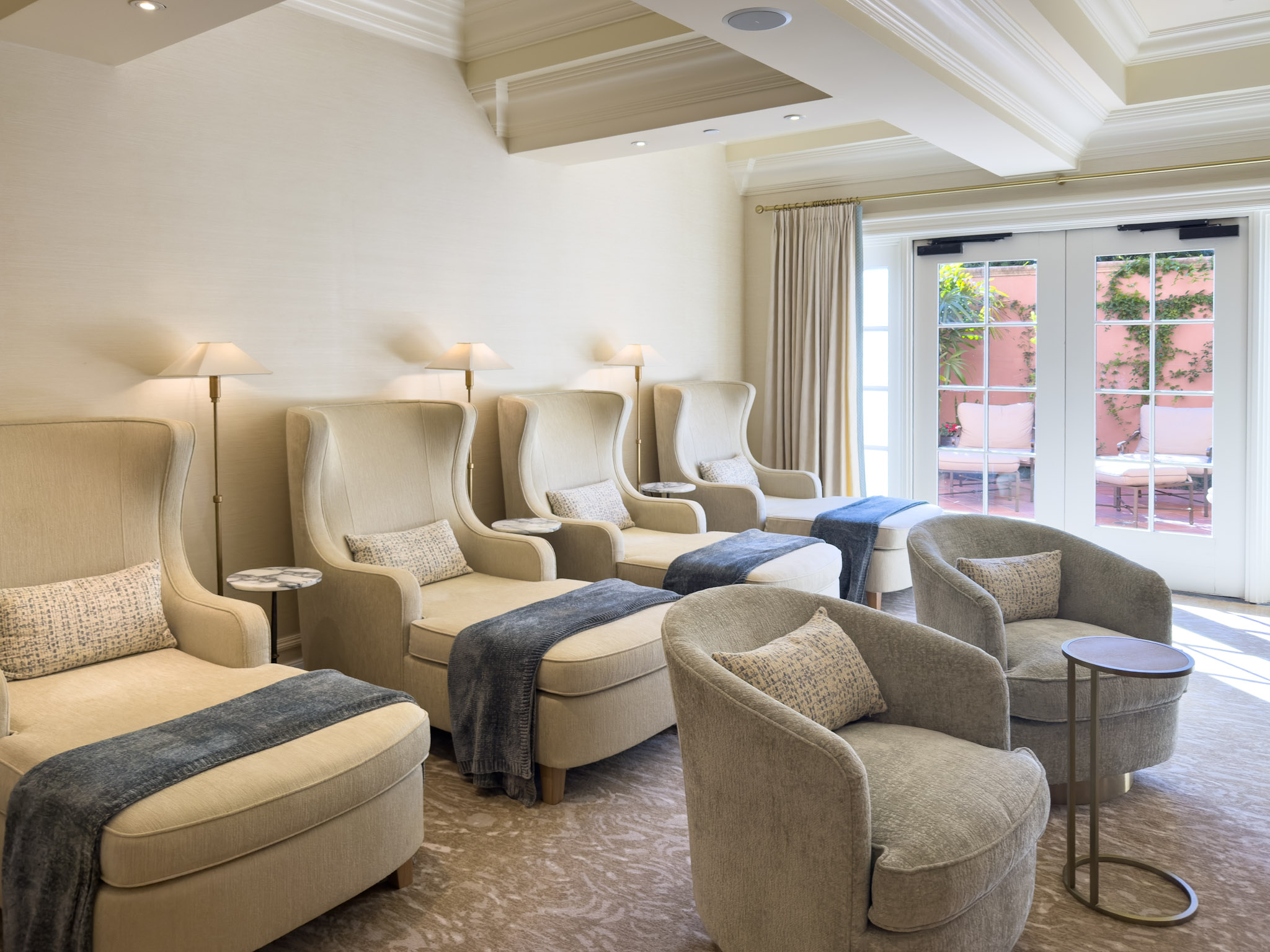 Confortable chaise lounges in the Fairmont Grand Del Mar Spa waiting area.