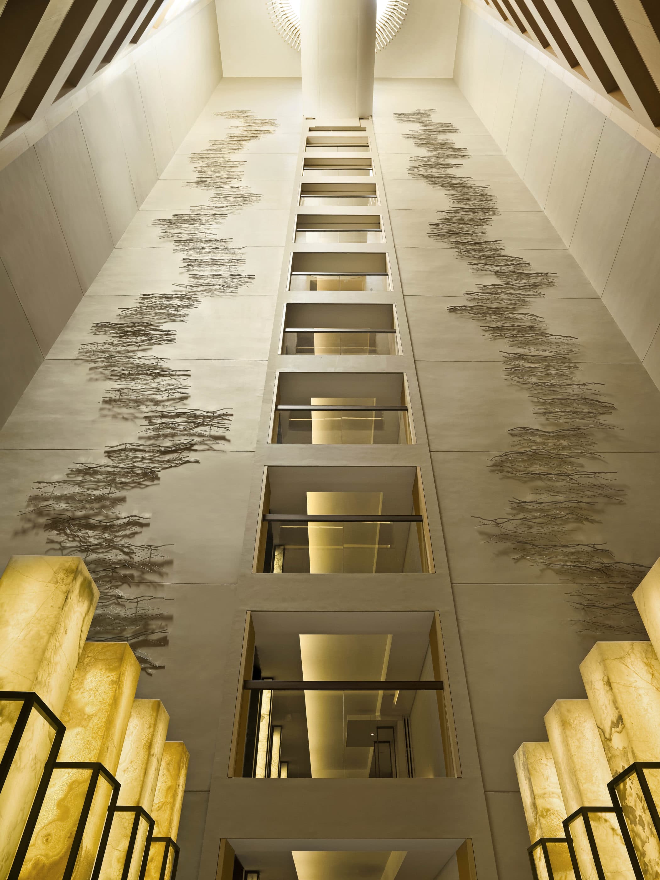 Upper House Hong Kong's interior atrium with multi-story art up the walls