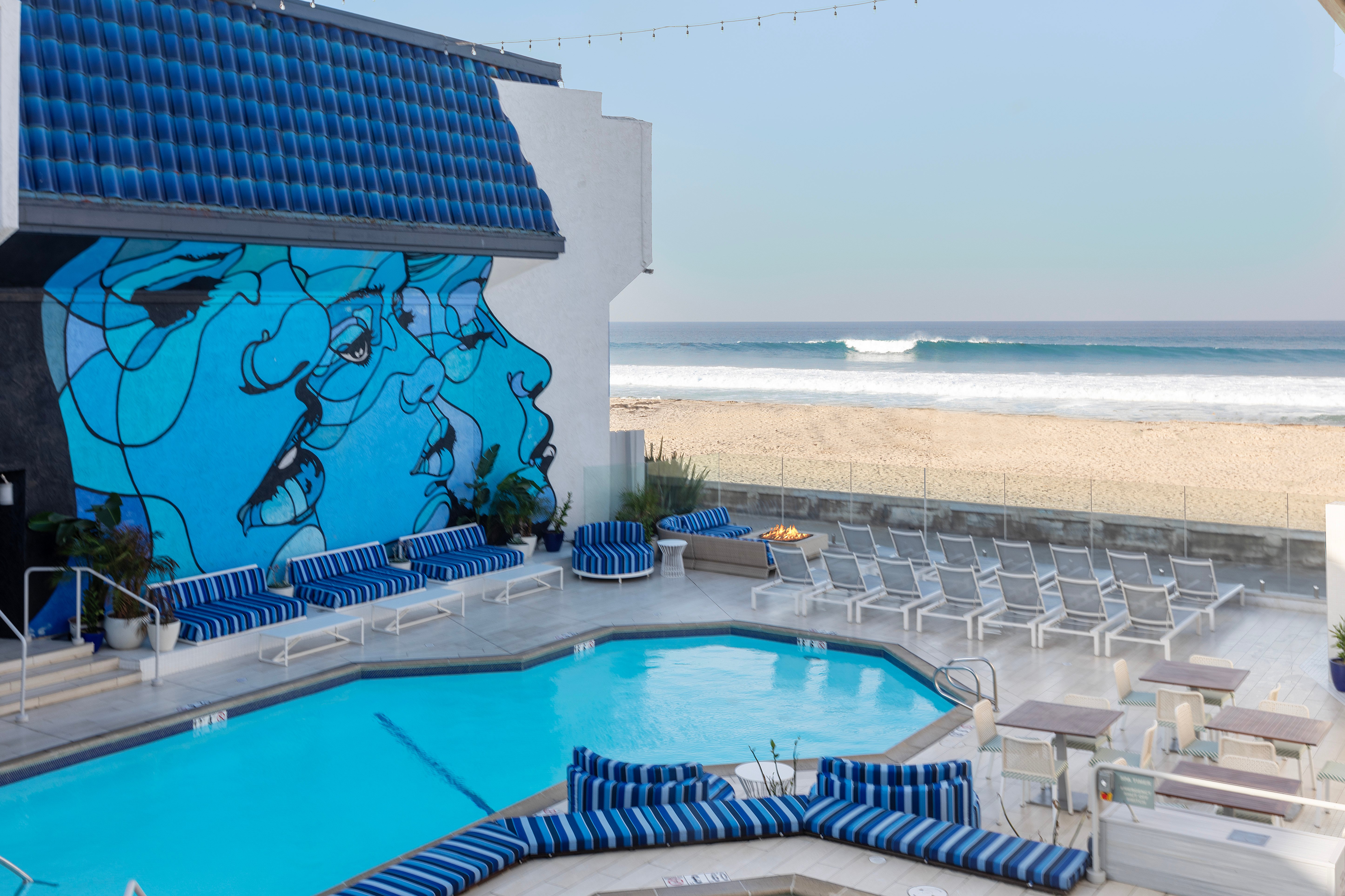 Blue mural and pool overlooking Pacific Beach.