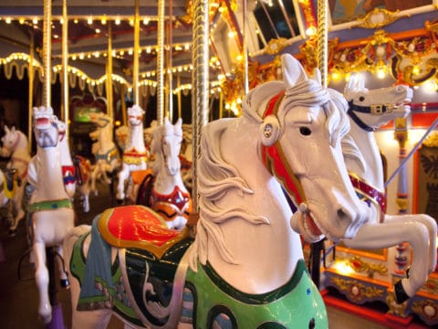 Close-up of a white horse on the King Arthur Carousel, one of the most popular Disneyland California rides for kids.