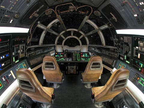 The Millennium Falcon cockpit inside Smugglers Run, a Star Wars ride at Disneyland.