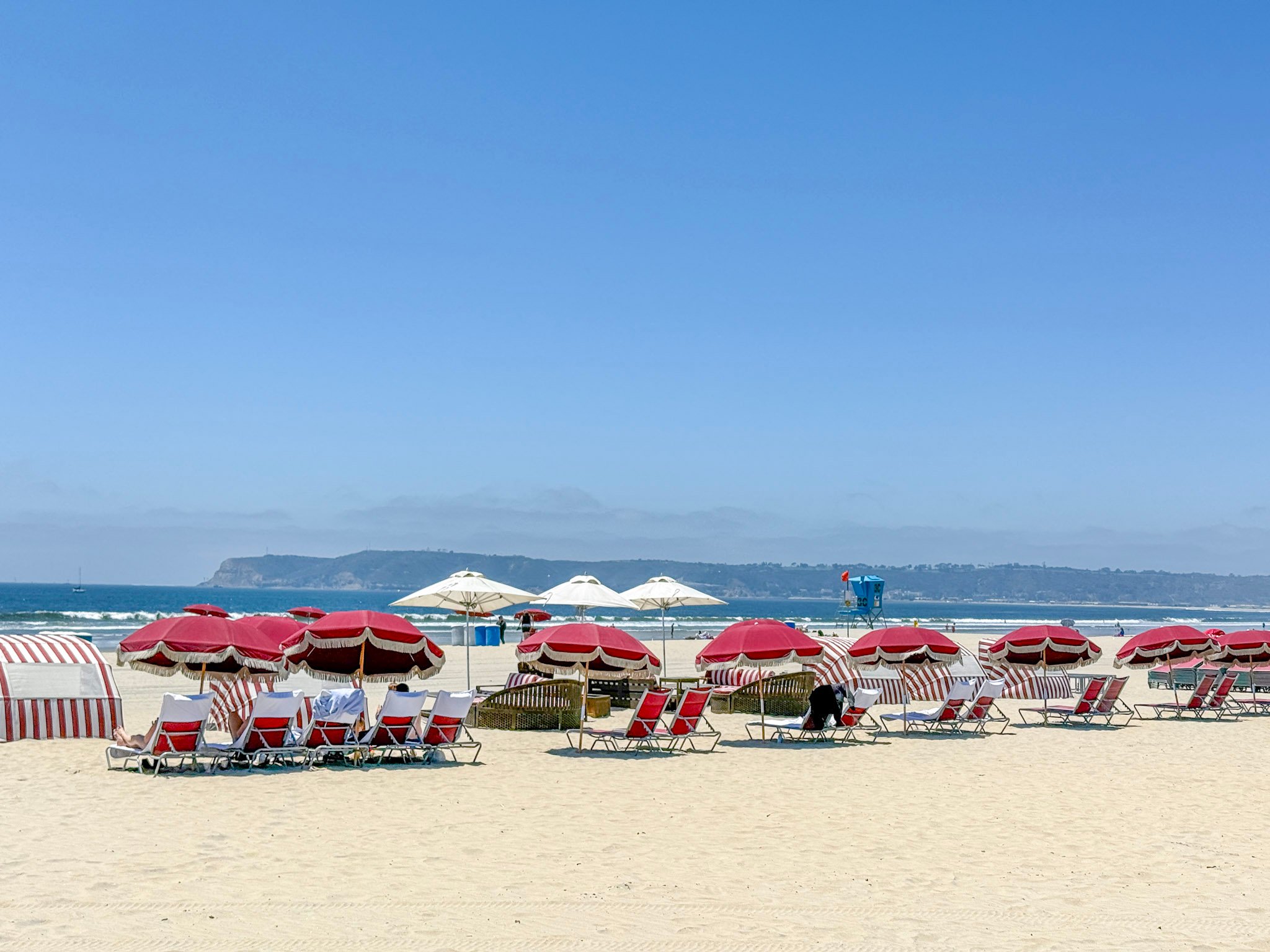 The Del Beach set up with chairs and umbrellas.