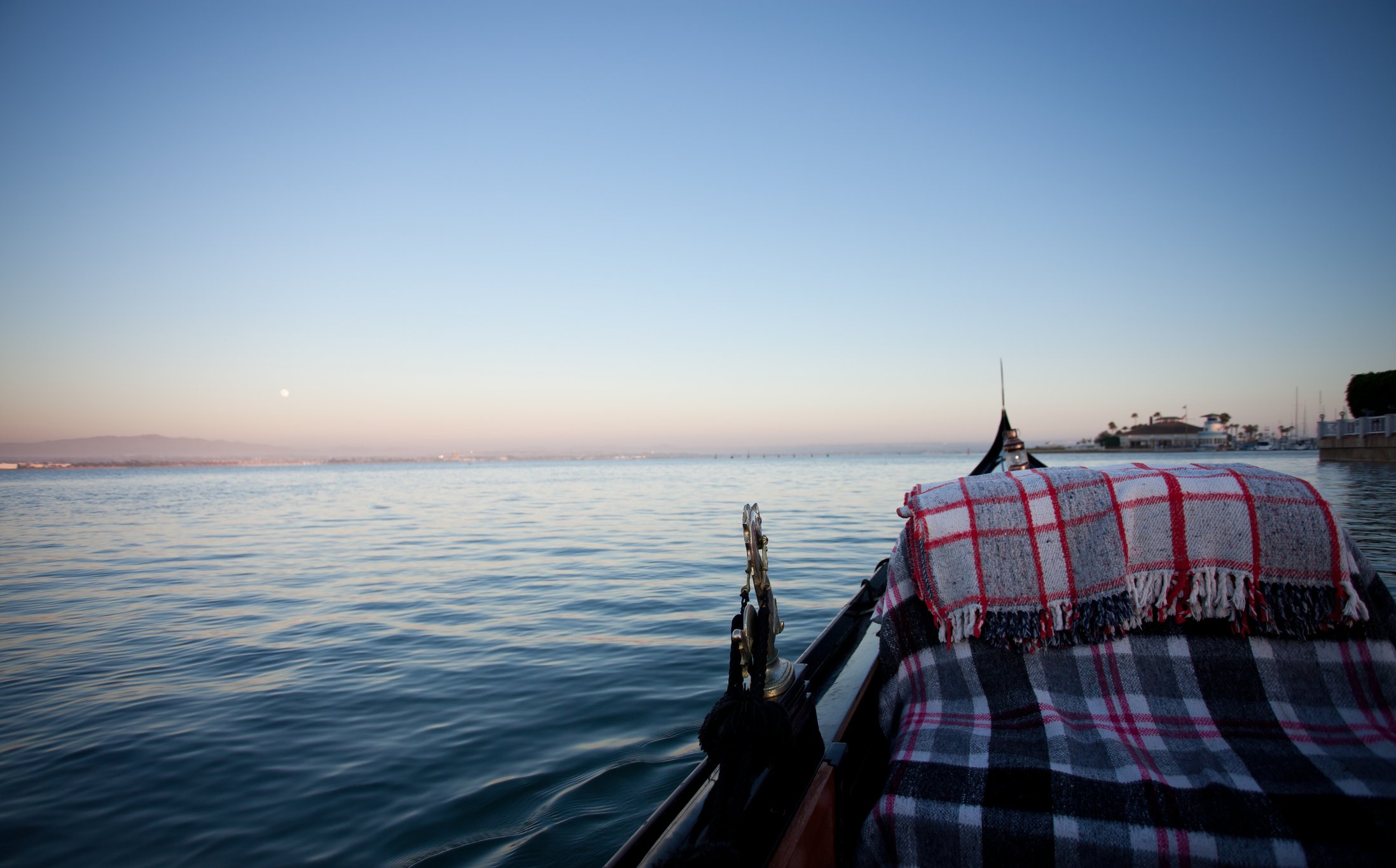 A gondola with blankets in San Diego Bay.
