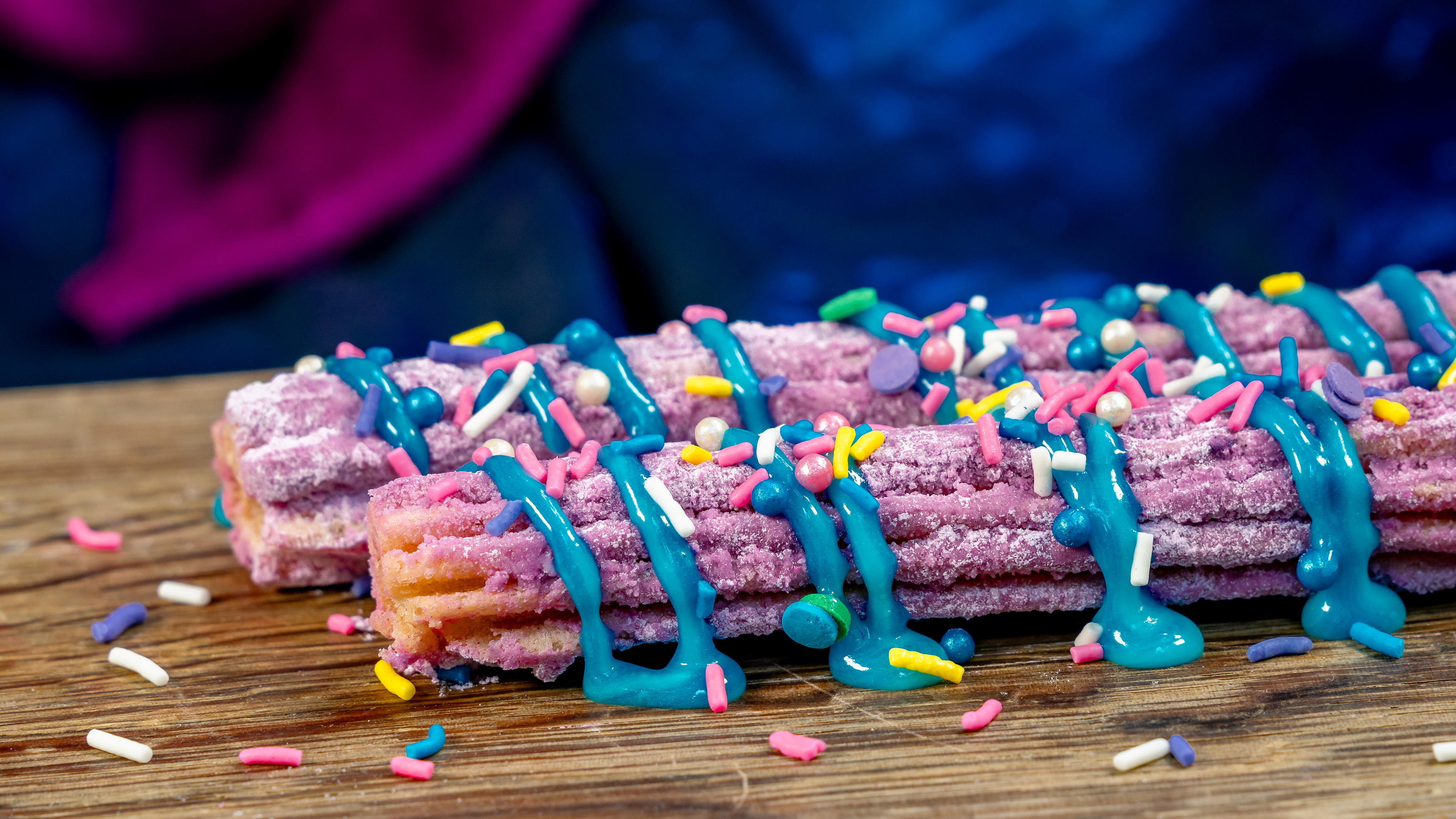 Churros with purple toppings and sprinkles
