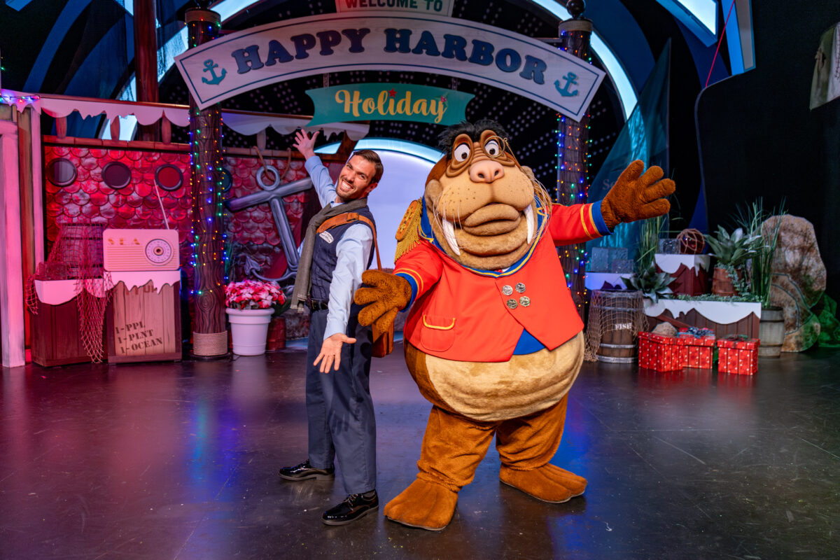 Sir Winston Walrus with a man in Seaworld San Diego