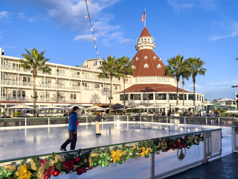 A guest ice skates in front of Hotel del Coronado in November.