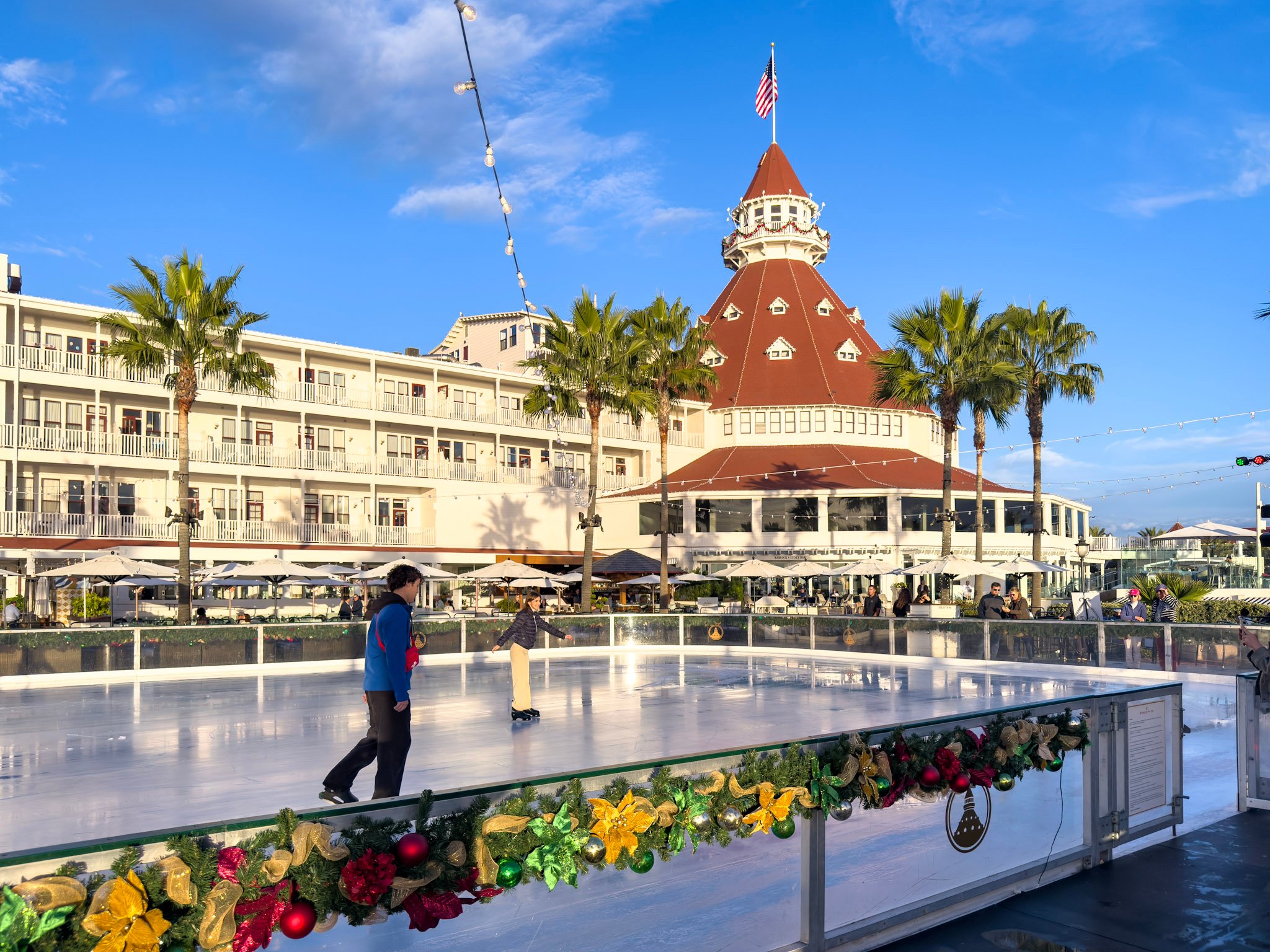 A guest ice skates in front of Hotel del Coronado in November.