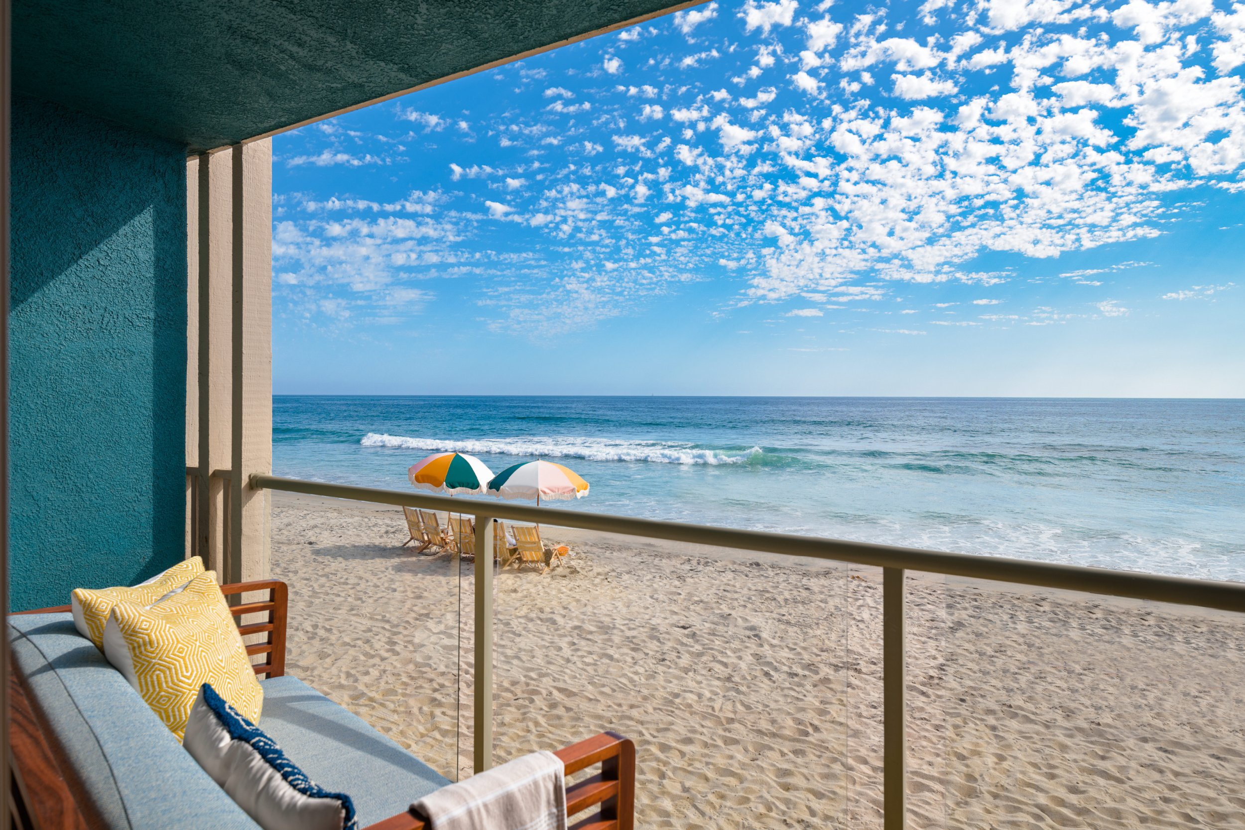 View from a room balcony right on the sand.