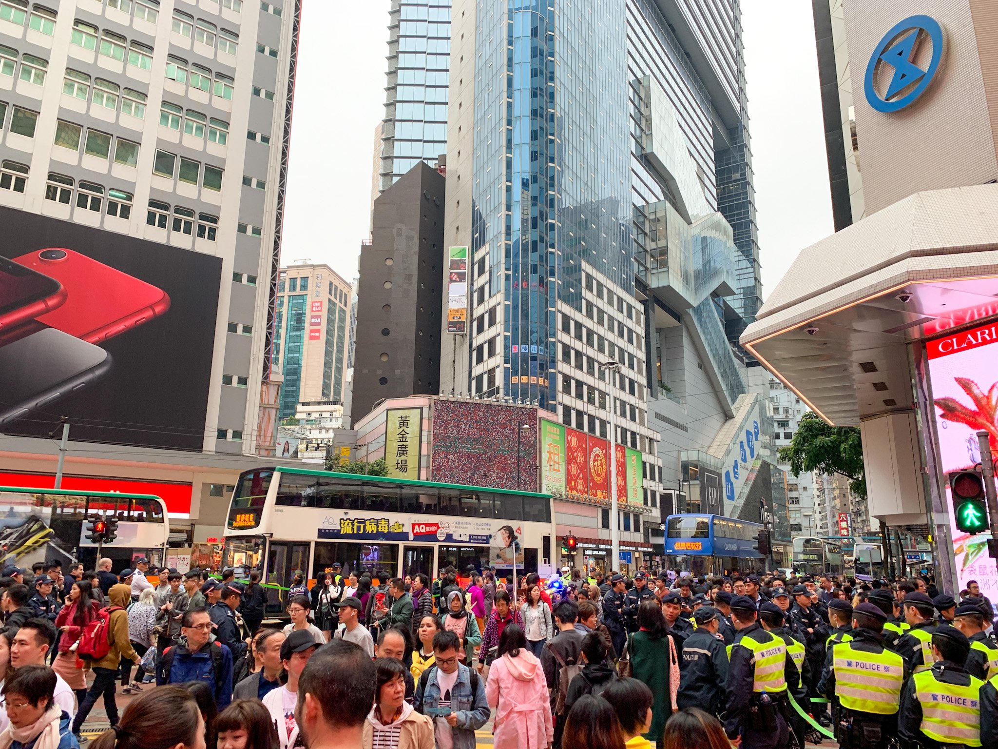 Crowds move between shops in front of Sogo in Causeway Bay.