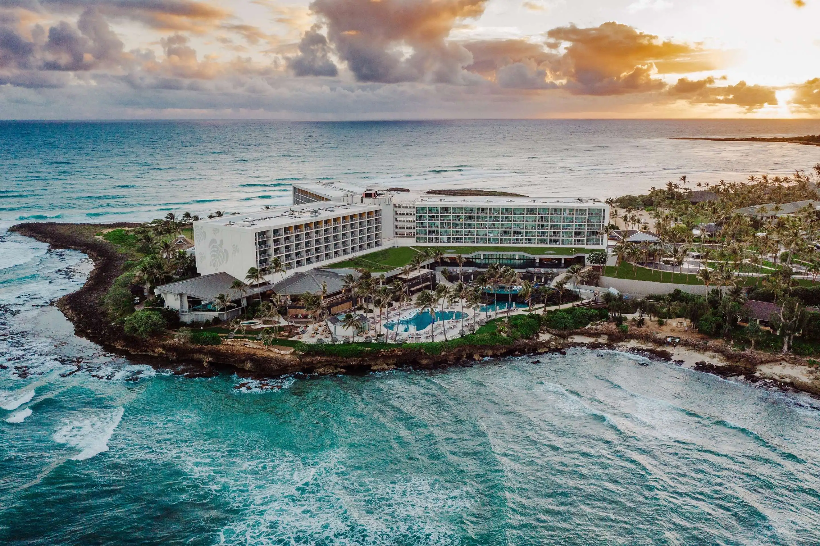Aerial view of The Ritz-Carlton Turtle Bay Resort surrounded by ocean.