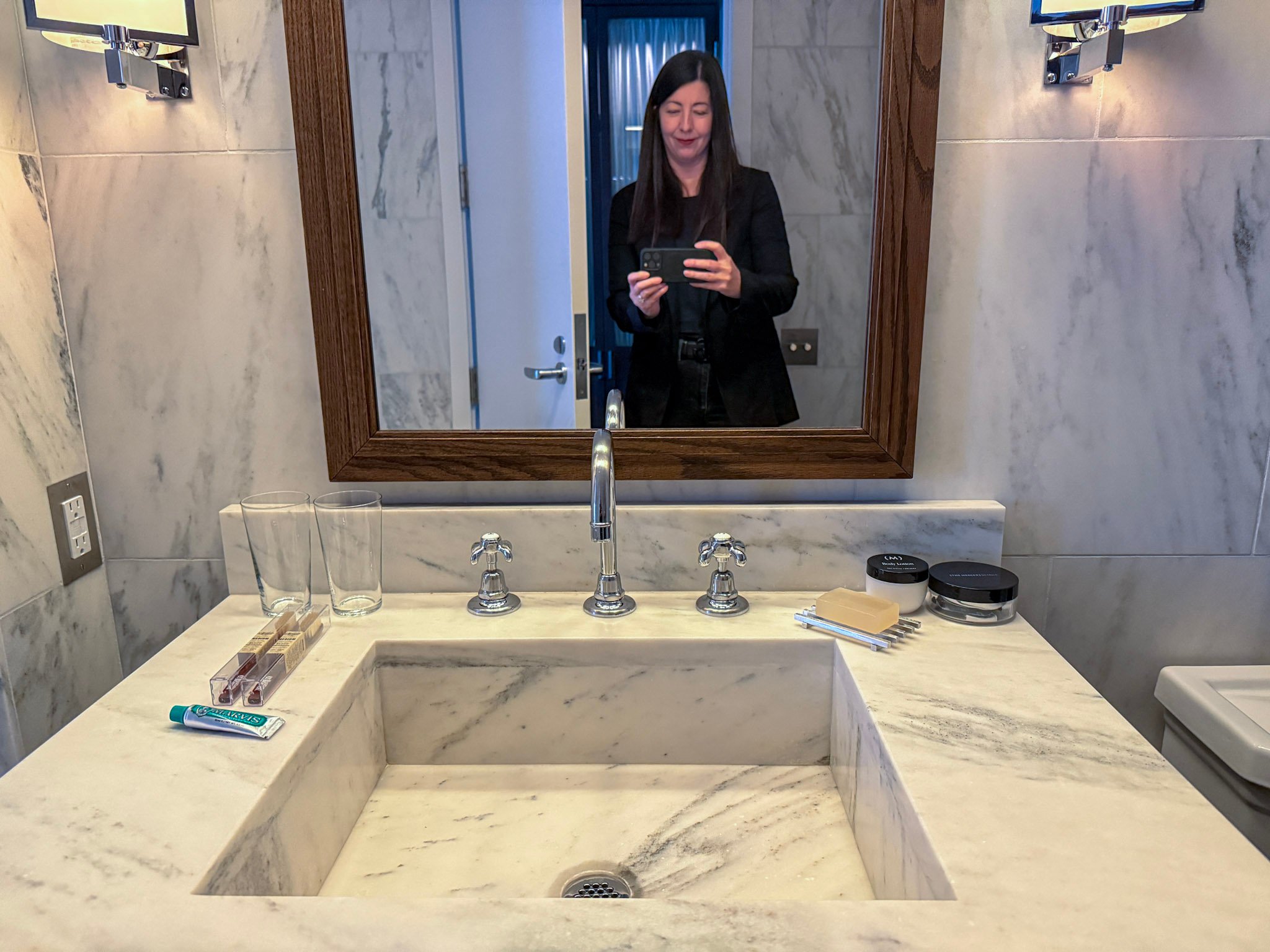 Me taking a photo of the sink area at The Mercer Hotel to review.