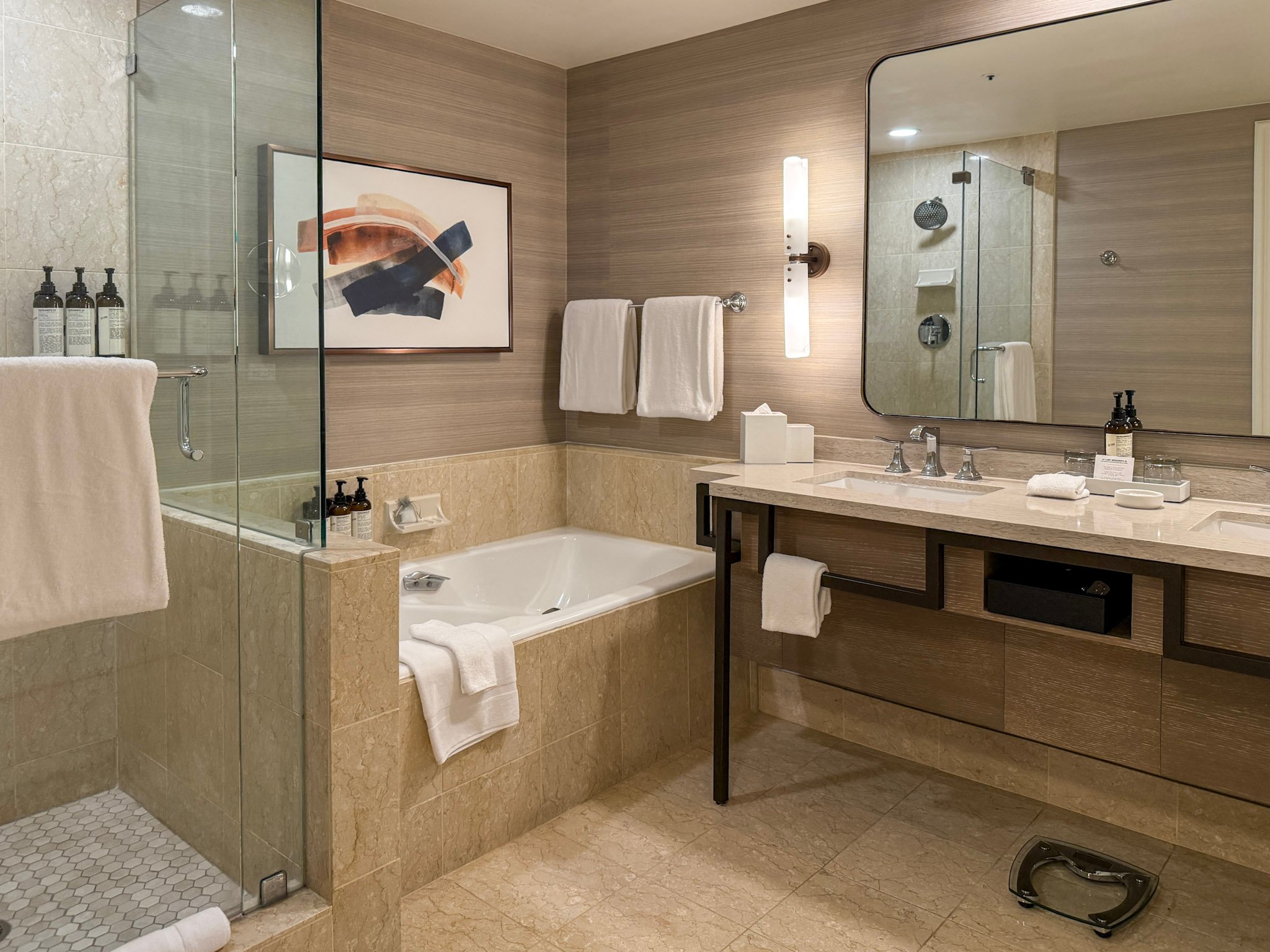 The beige marble bathroom of my Premium Coastal View Suite.