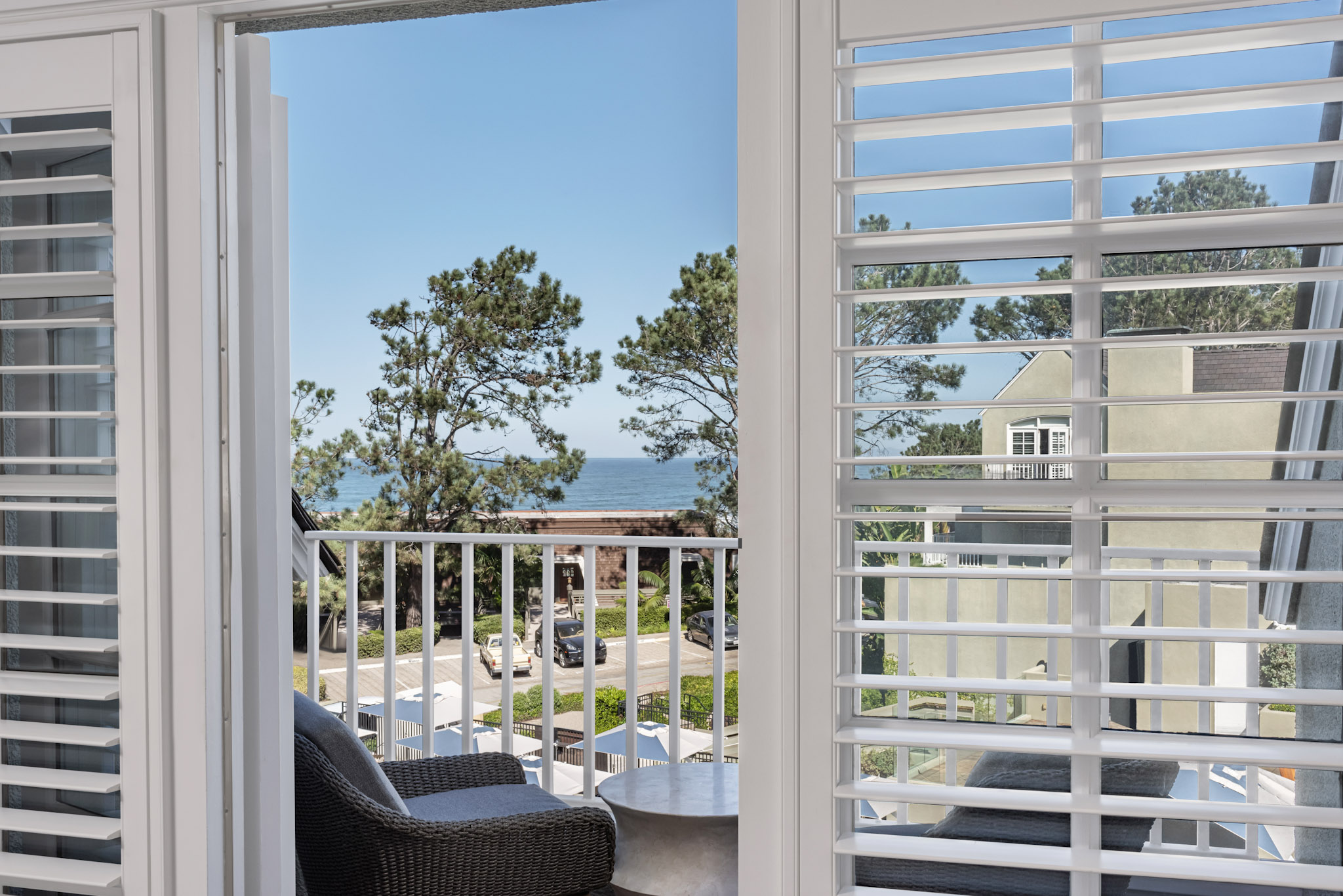 Ocean view through plantation shutters from the Coastal King room.