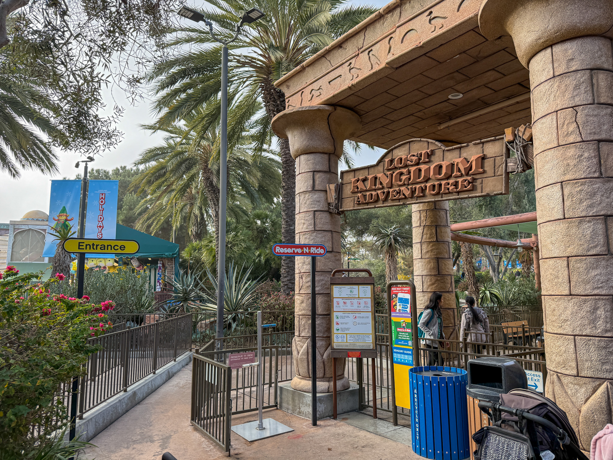 An old Reserve N Ride sign in front of Lost Kingdom Adventure at LEGOLAND California.