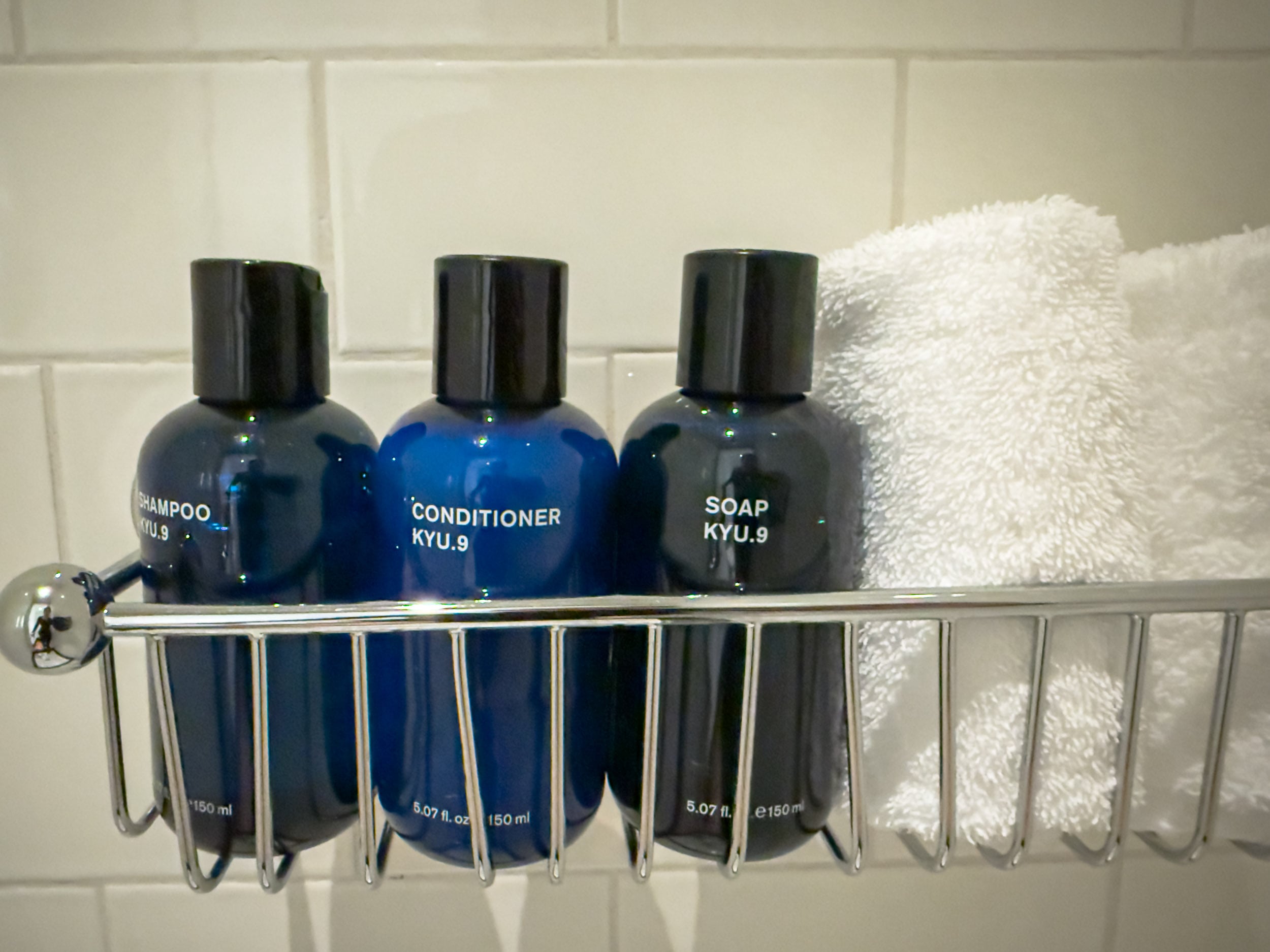 KYU.9 shampoo, conditioner and soap in a Nine Orchard shower