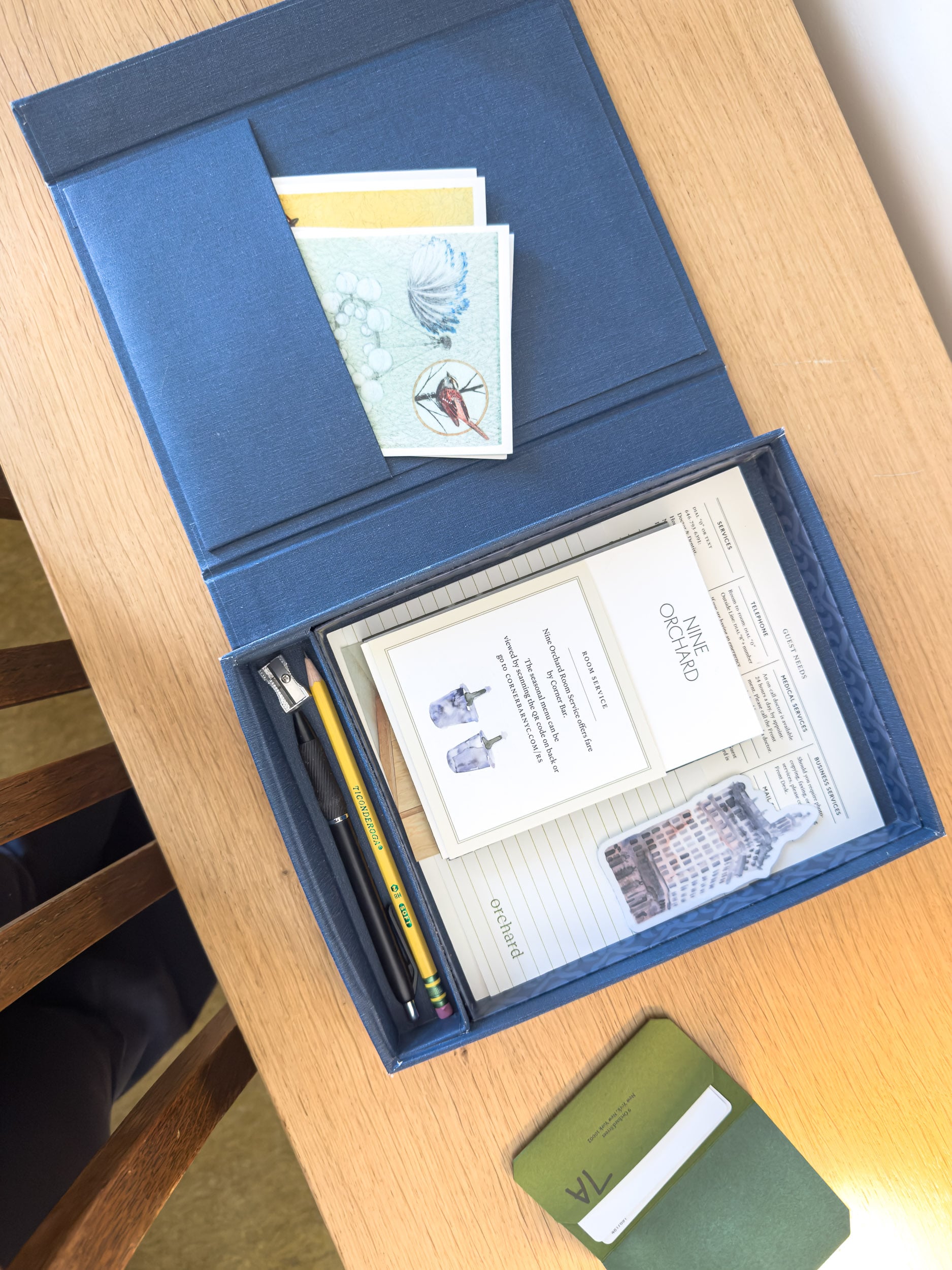Nine Orchard hotel information presented in a keepsake box with stationery