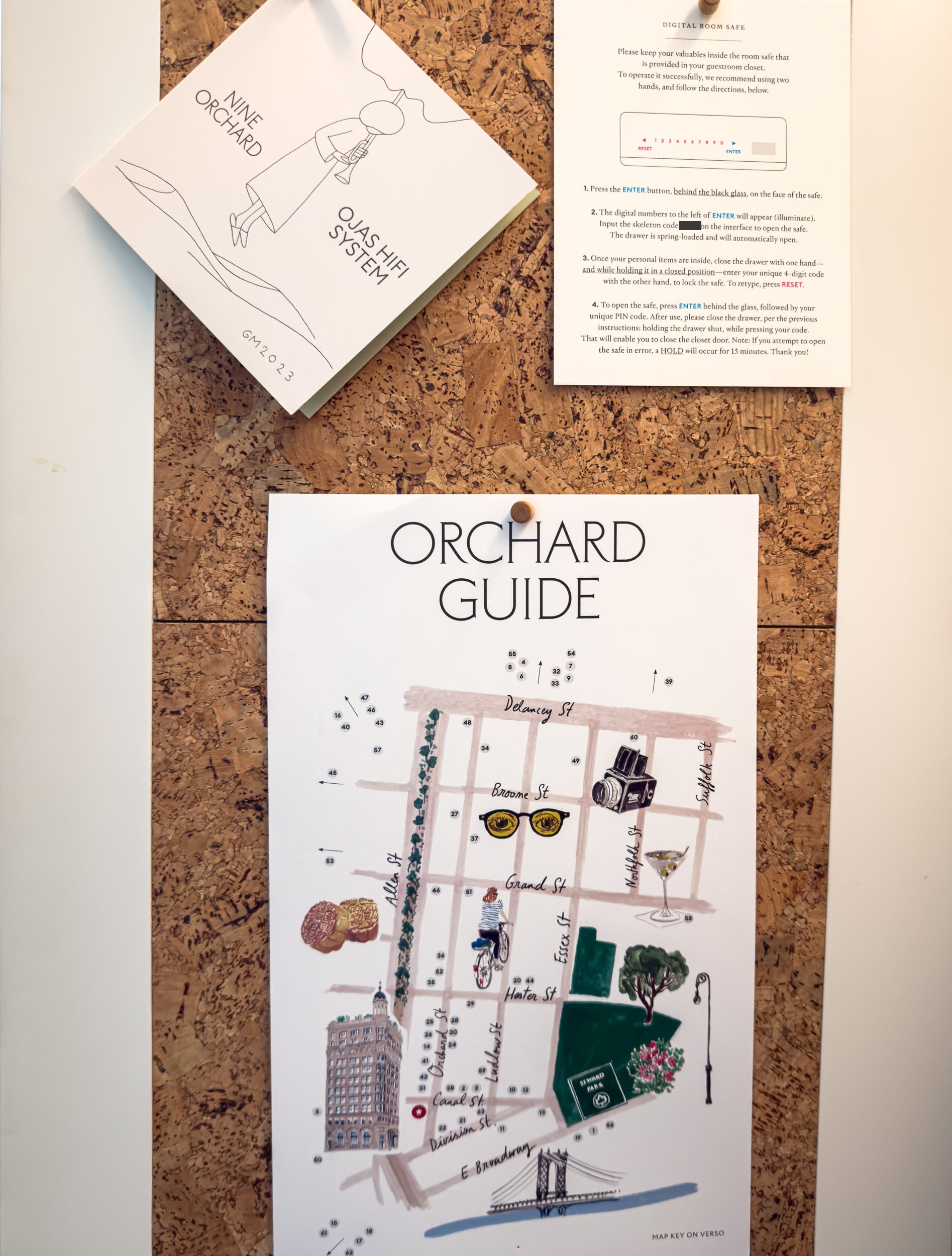 The Ojas HiFi System card and illustrated Orchard Guide neighborhood map at Nine Orchard