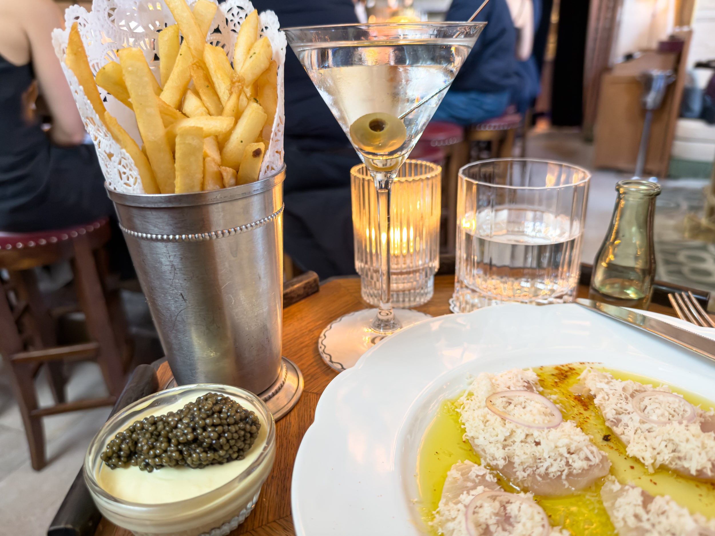 Fries with caviar, a vodka martini and hamachi crudo at the Swan Room, Nine Orchard