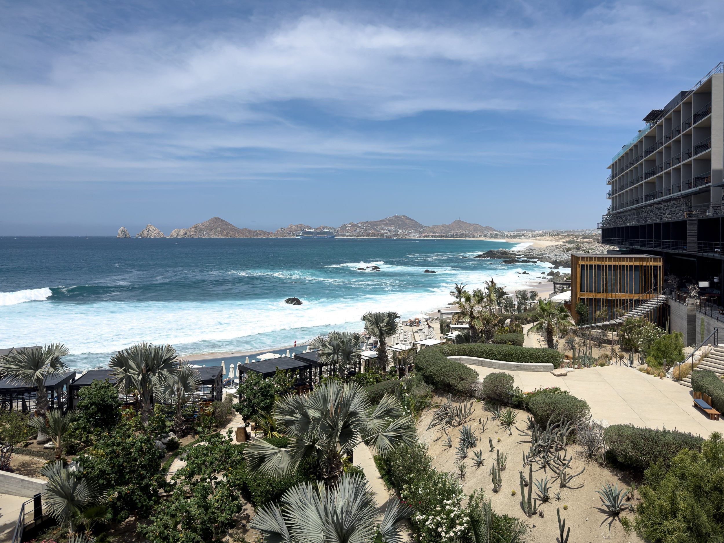 Beachfront grounds with cactus gardens and crashing surf at The Cape, a Thompson Hotel in Cabo San Lucas
