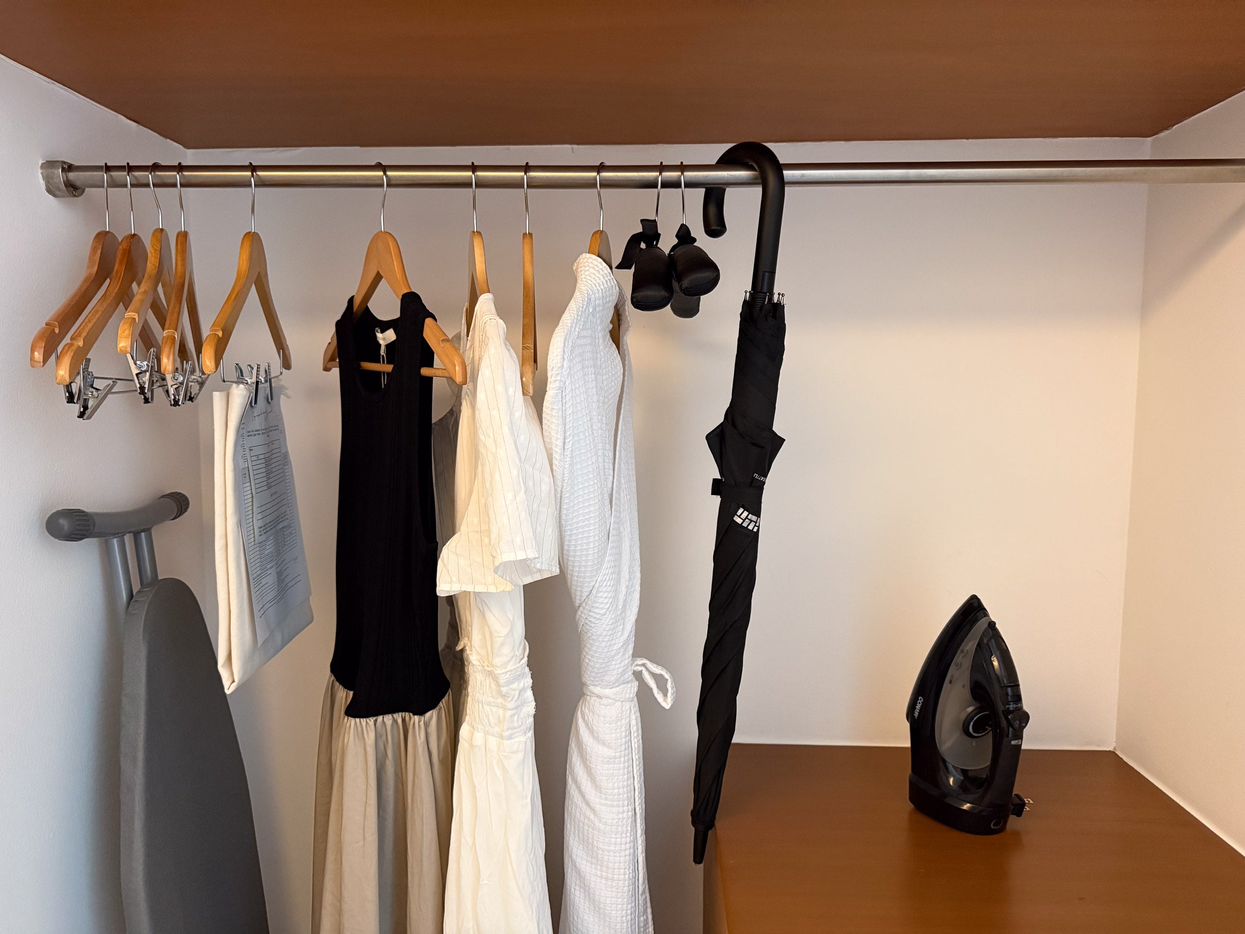 Closet with robes and an iron in a guest room at The Cape, a Thompson Hotel