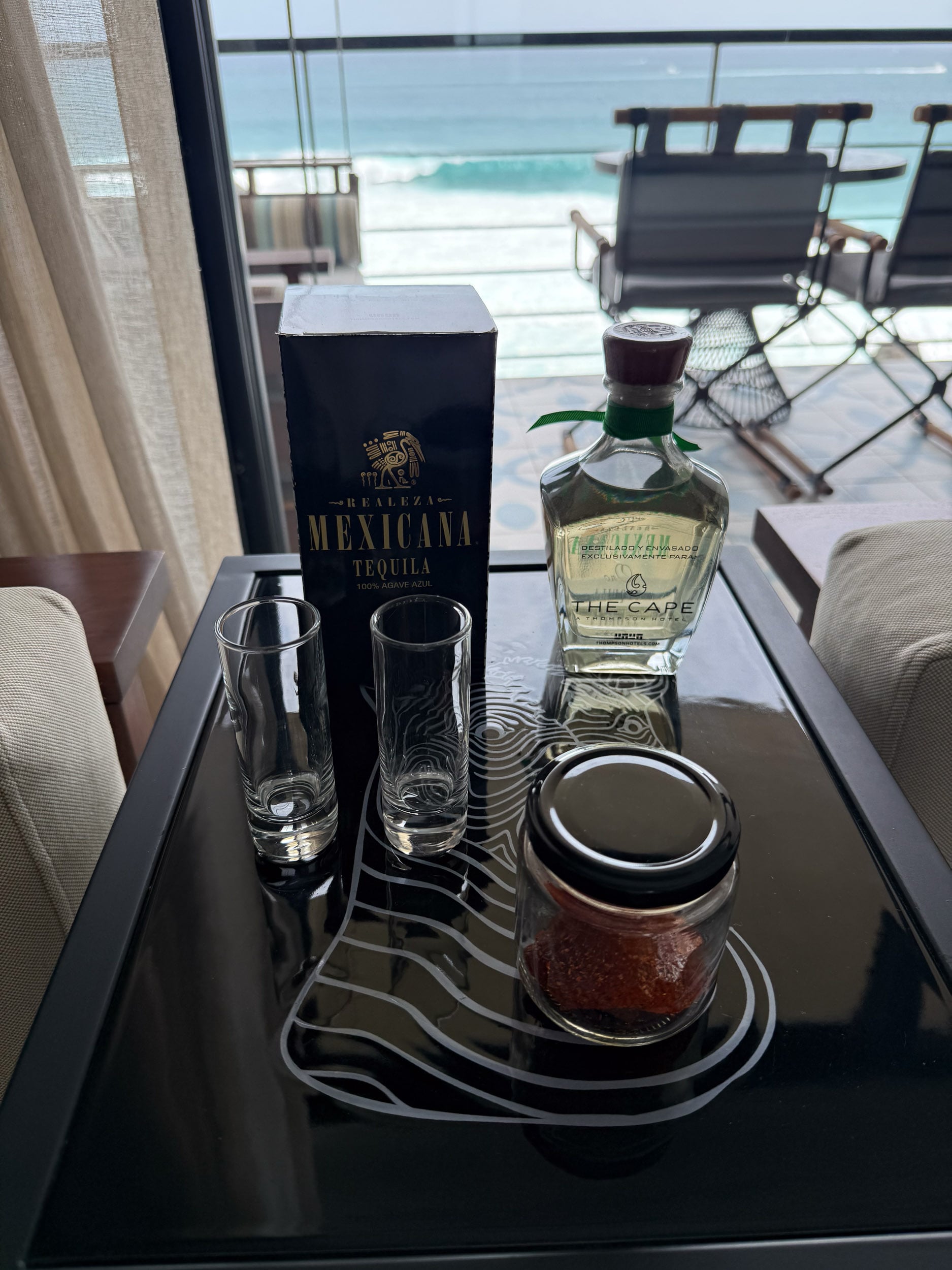 Tequila welcome amenity with glasses at The Cape, a Thompson Hotel