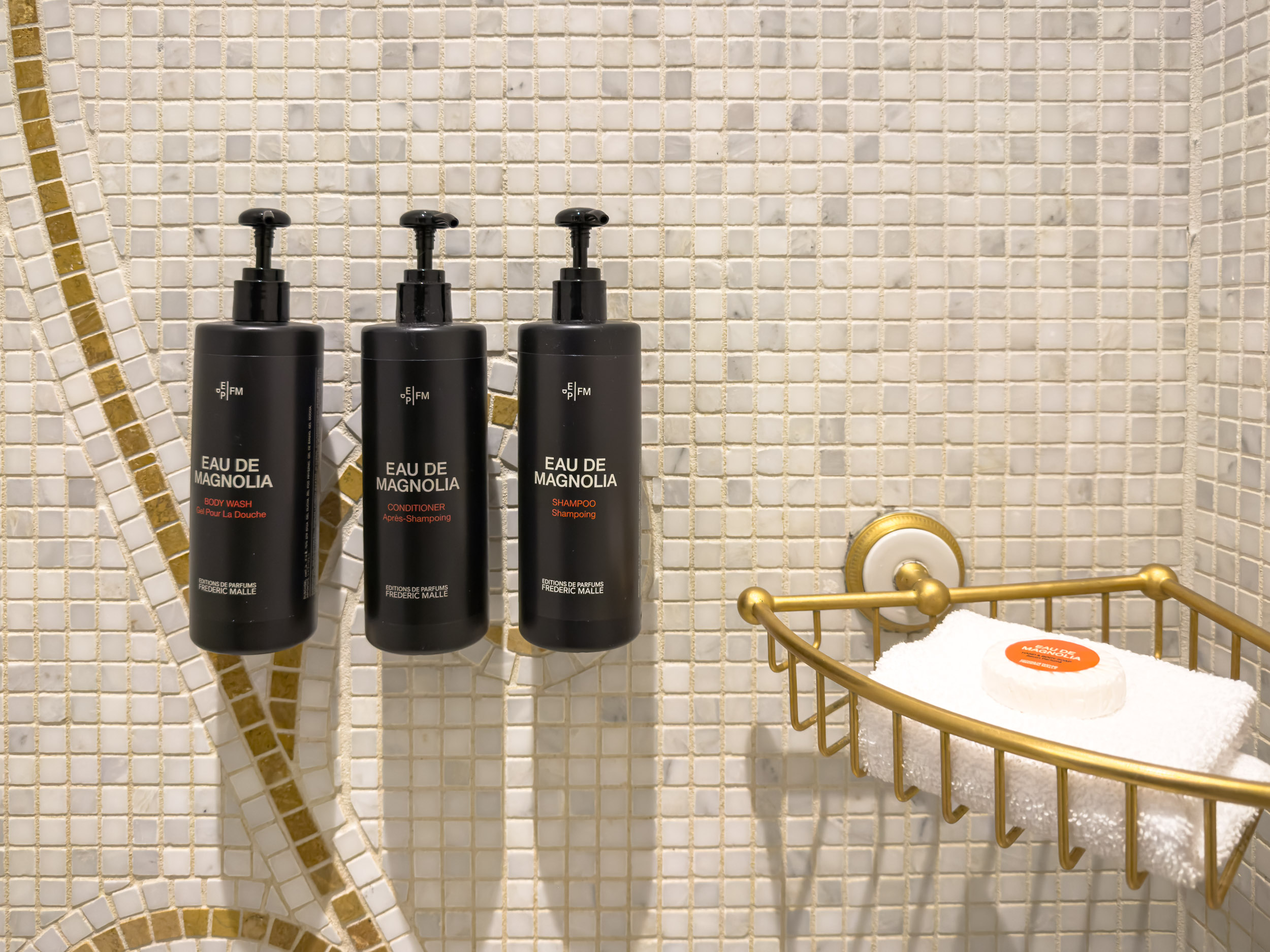 Shower with mosaic tile and Eau de Magnolia bath products at The Plaza Hotel New York