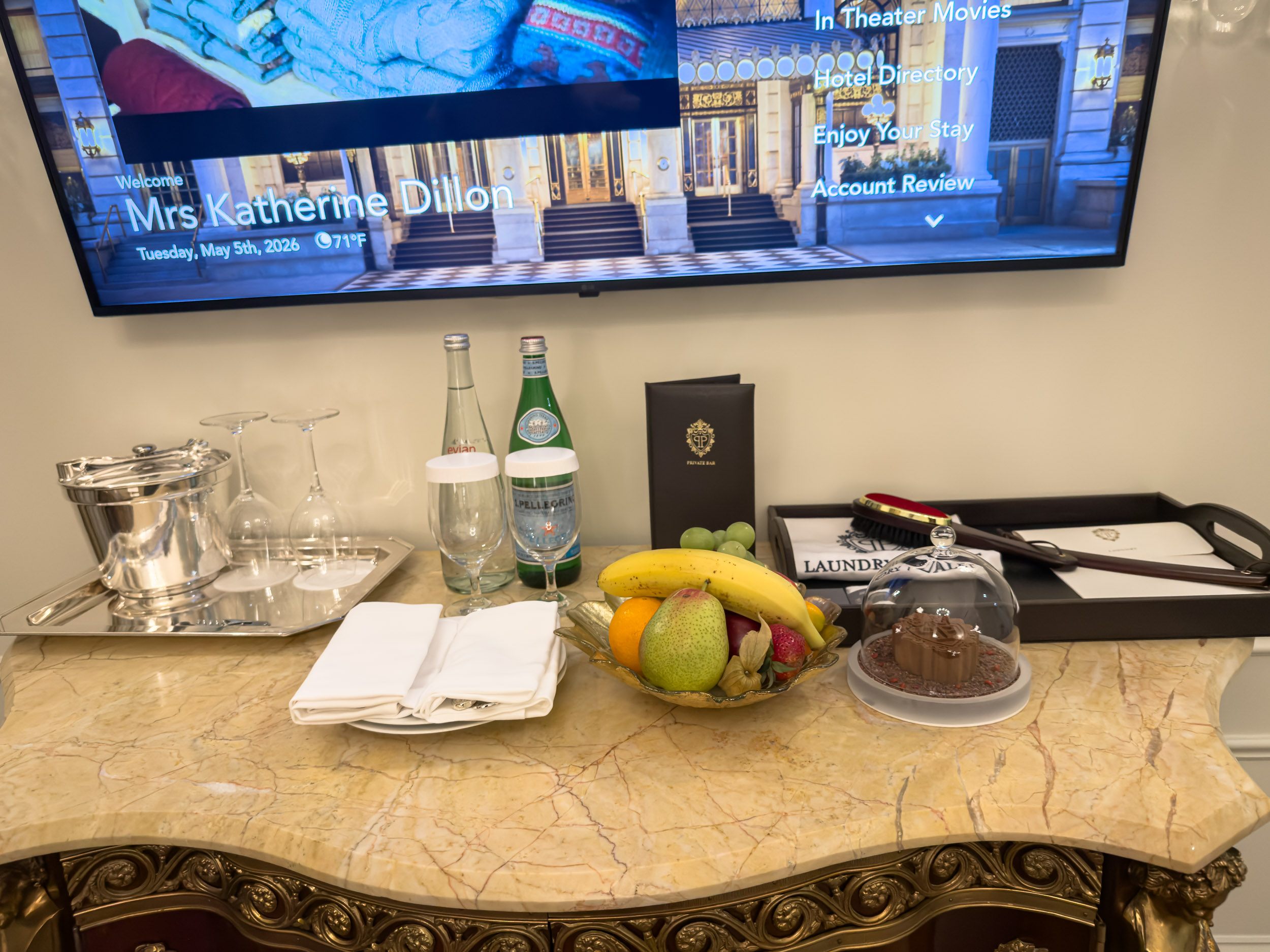 Welcome amenity of fresh fruit and bottled water on a marble commode at The Plaza Hotel New York