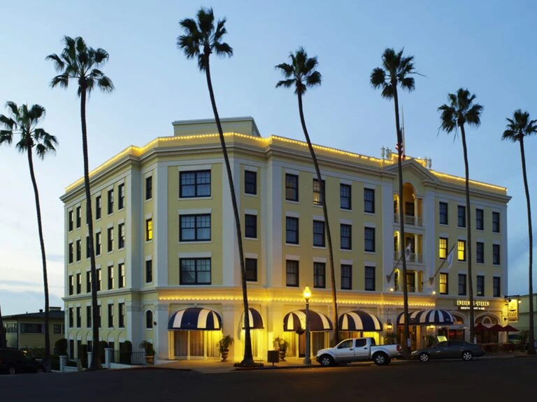 Exterior of Grande Colonial hotel in La Jolla at sunset
