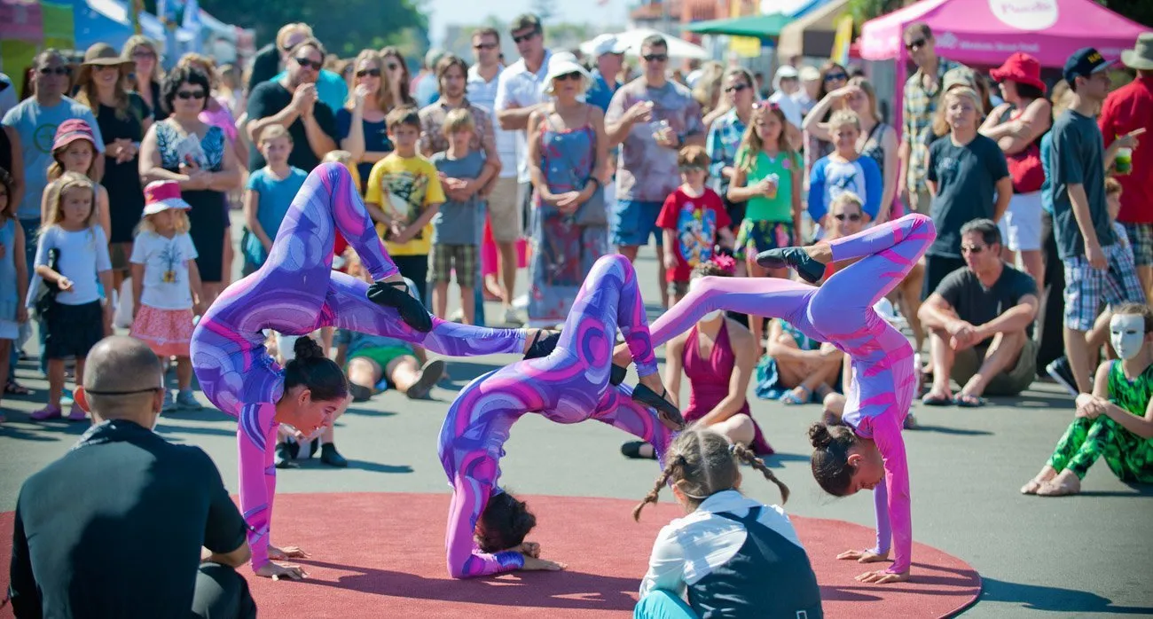 Live entertainment at the La Jolla Art and Wine Festival includes circus performers and other roaming acts.