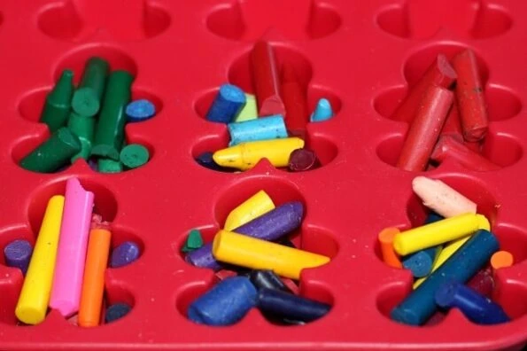 broken crayons in a gingerbread man shaped silicon pan.