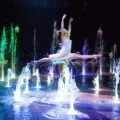 A dancer gracefully leaps over water on stage at House of Dancing Water in Macau.