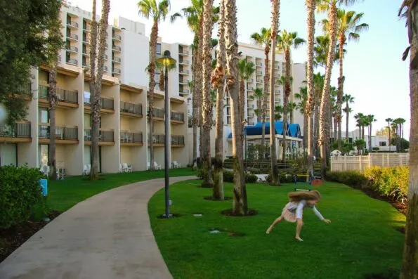 My daughter doing a cartwheel on the hotel lawn