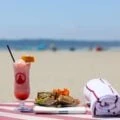 Drink towel and sandwich on a chair at Del Beach in Coronado.