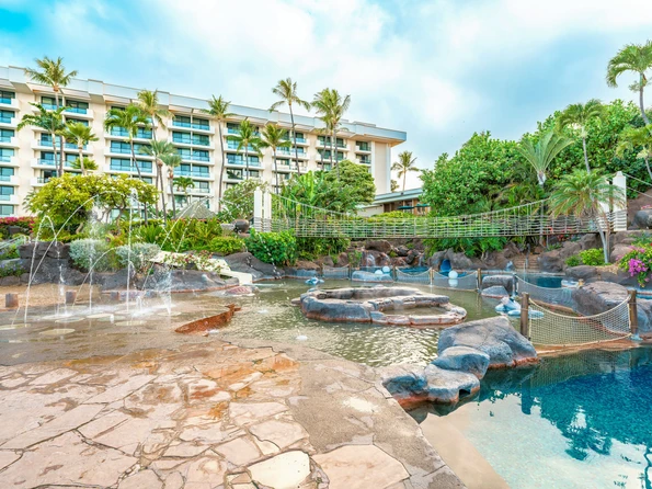 The splash pad, shallow pools, and bridges in the keiki pool area at Hyatt Regency Maui.