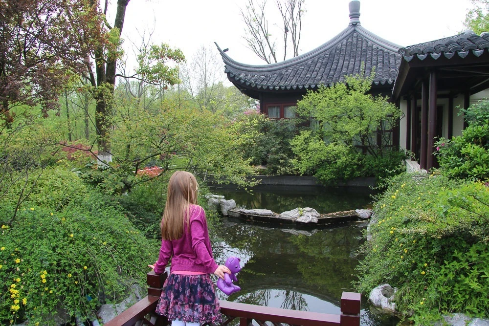 My daughter in front of a pagoda at Four Seasons Hotel Hangzhou West Lake