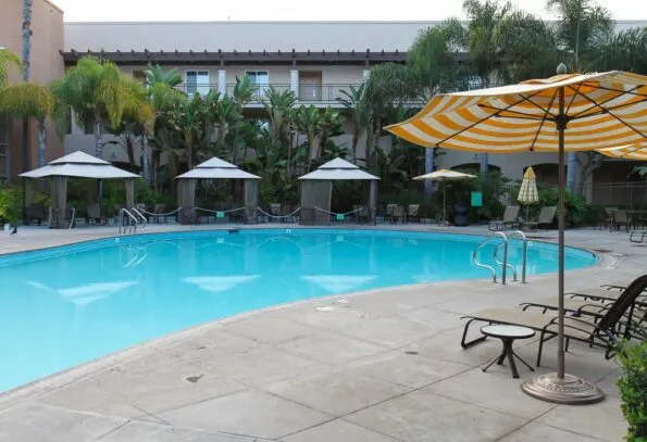 Family pool with cabanas and water play area at Grand Pacific Palisades in Carlsbad