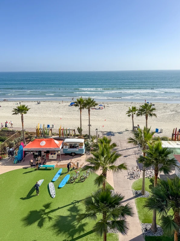 View of the surfboard rentals and the ocean beyond at Hotel del Coronado.