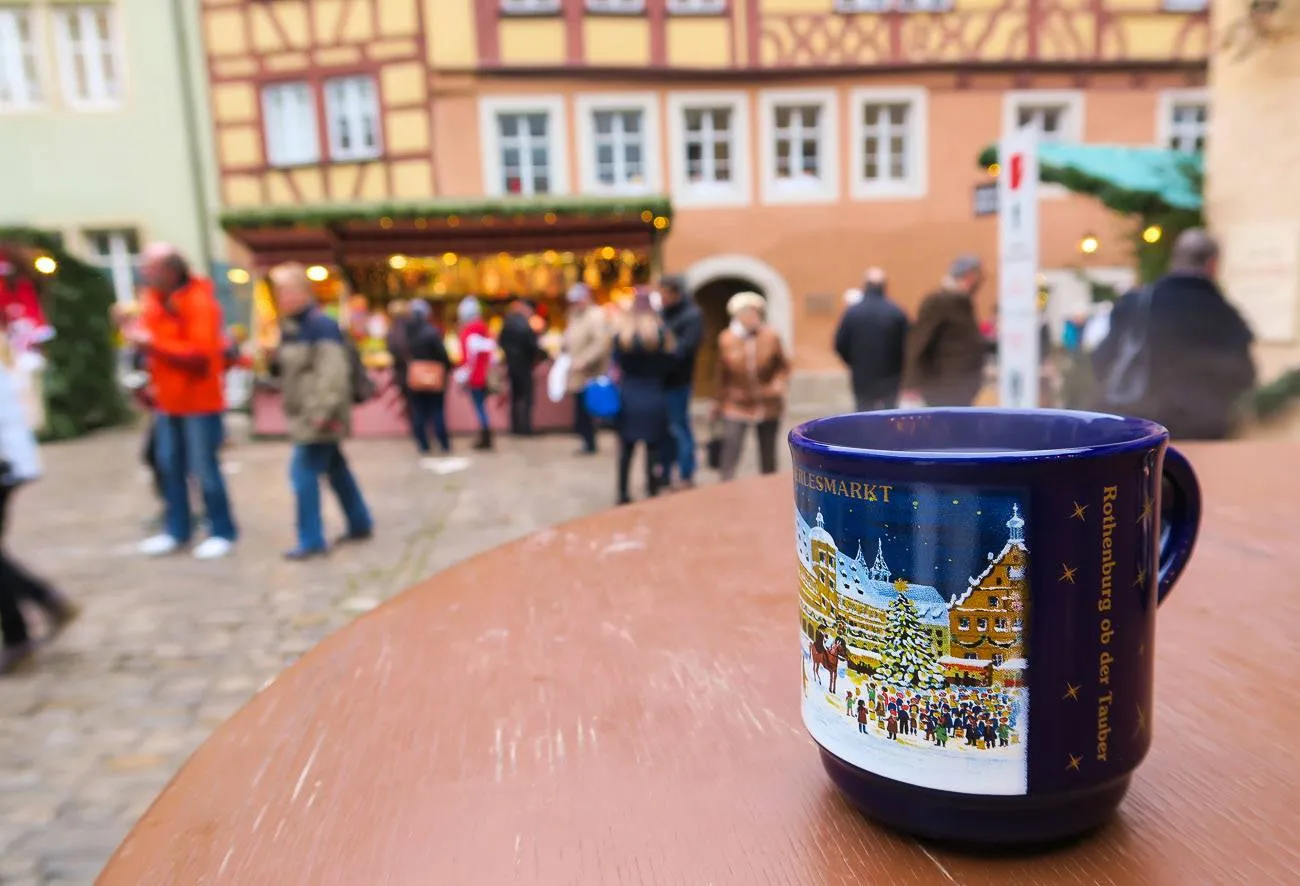 Warm up at the Rothenburg Christmas Market by drinking gluhwein