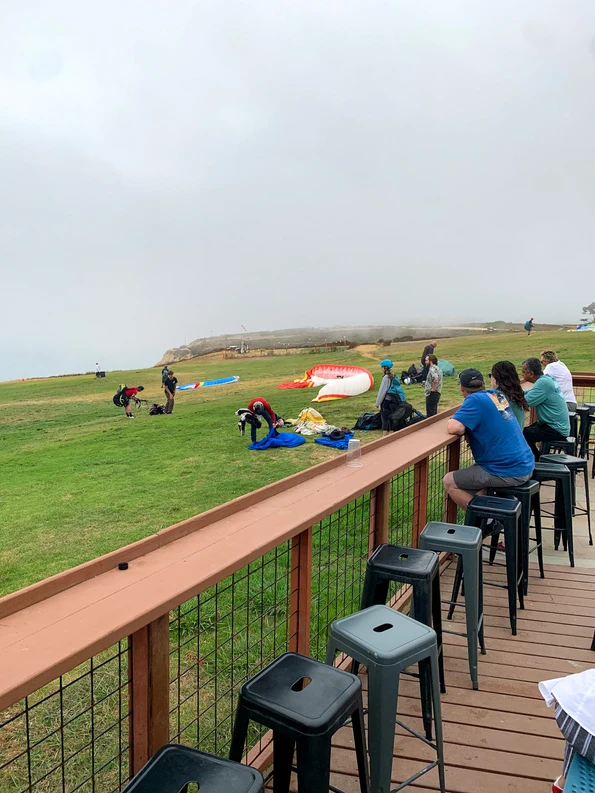 Visitors watch gliders set up to launch.