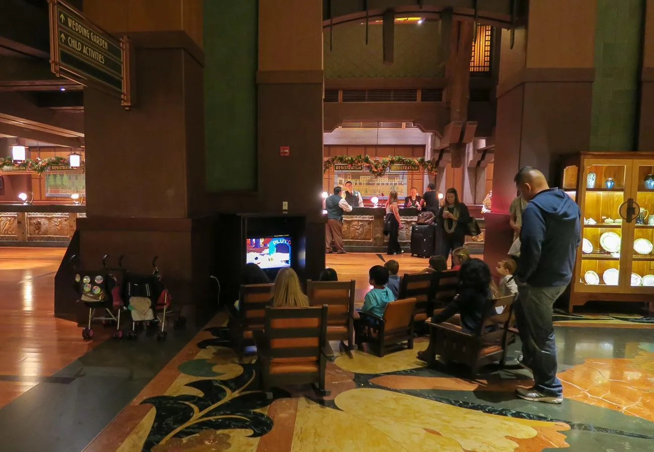 A TV plays Disney cartoons in the lobby of Disney's Grand Californian Hotel and Spa